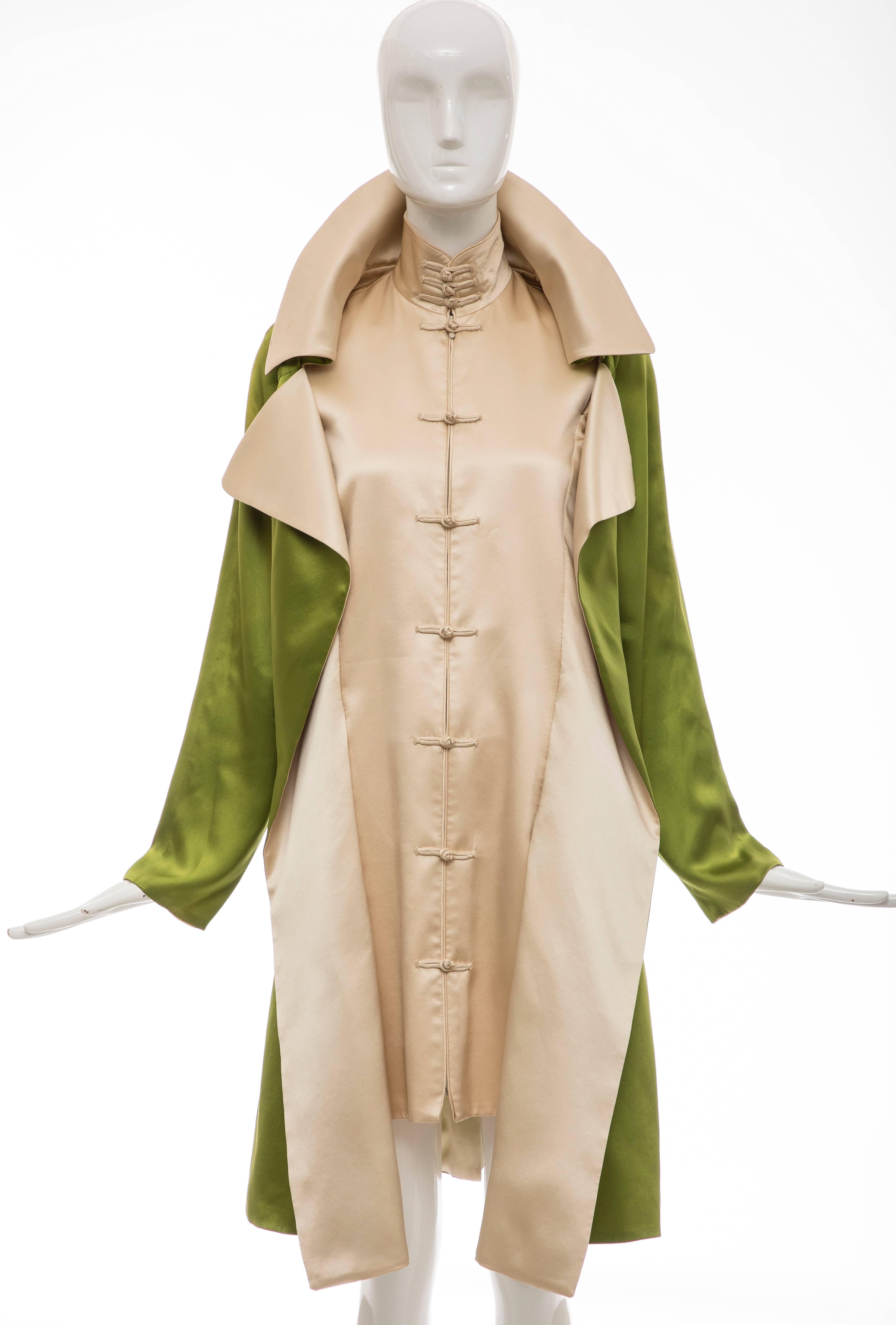 Jean Paul Gaultier, Autumn-Winter 2010 silk charmeuse dress coat with dual welt pockets, toggle closures at front and concealed zip closure at front.

Bust: 36, Waist 36, Shoulder 16, Length 39, Sleeve 23.5
