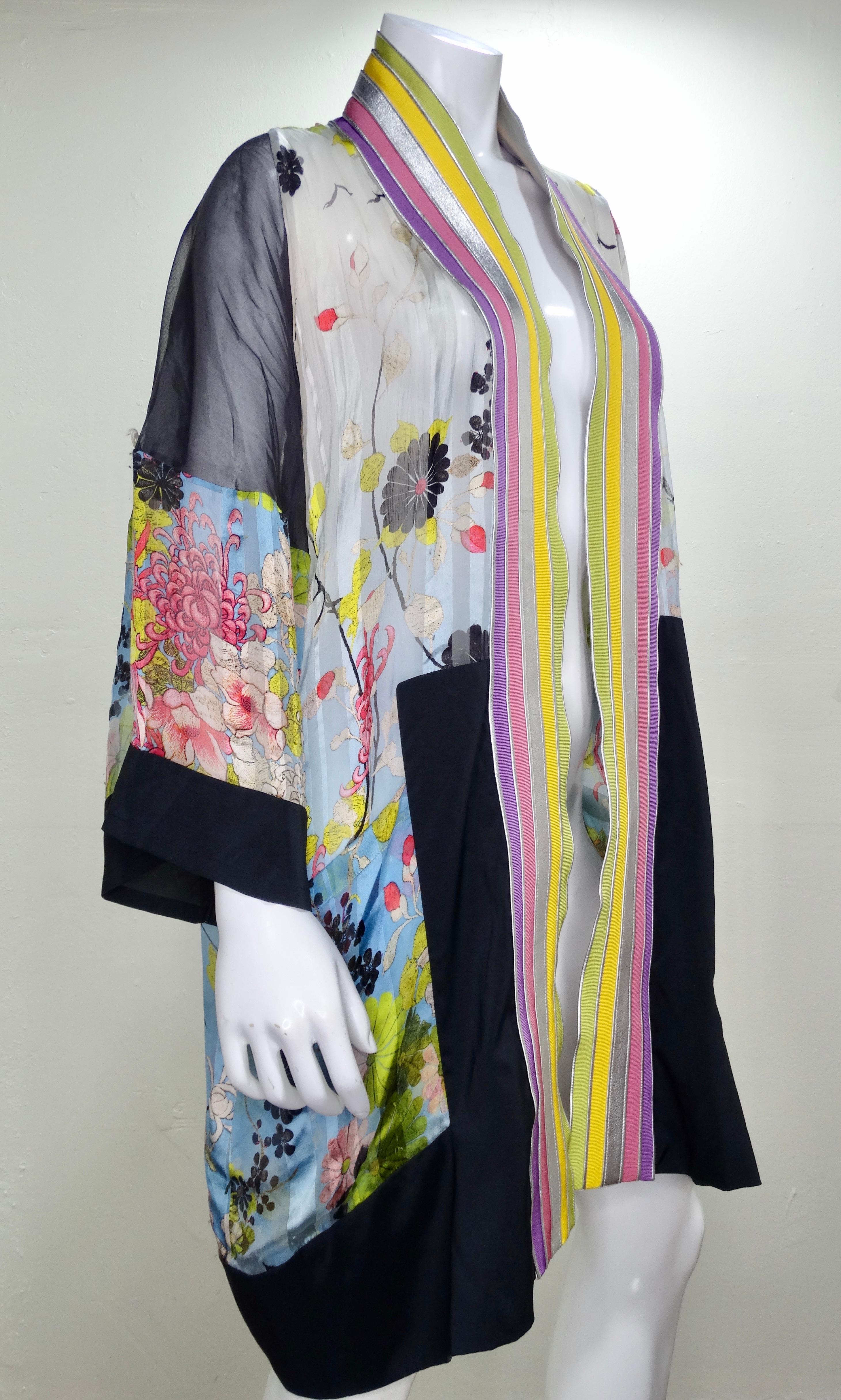Add some color to your look with this beautiful JPG kimono jacket! Circa 2002s, this piece features a colorful floral print with a multi-colored fabric and leather trim in the front. Loose and flowy fit with two front pockets and sleeves that can be