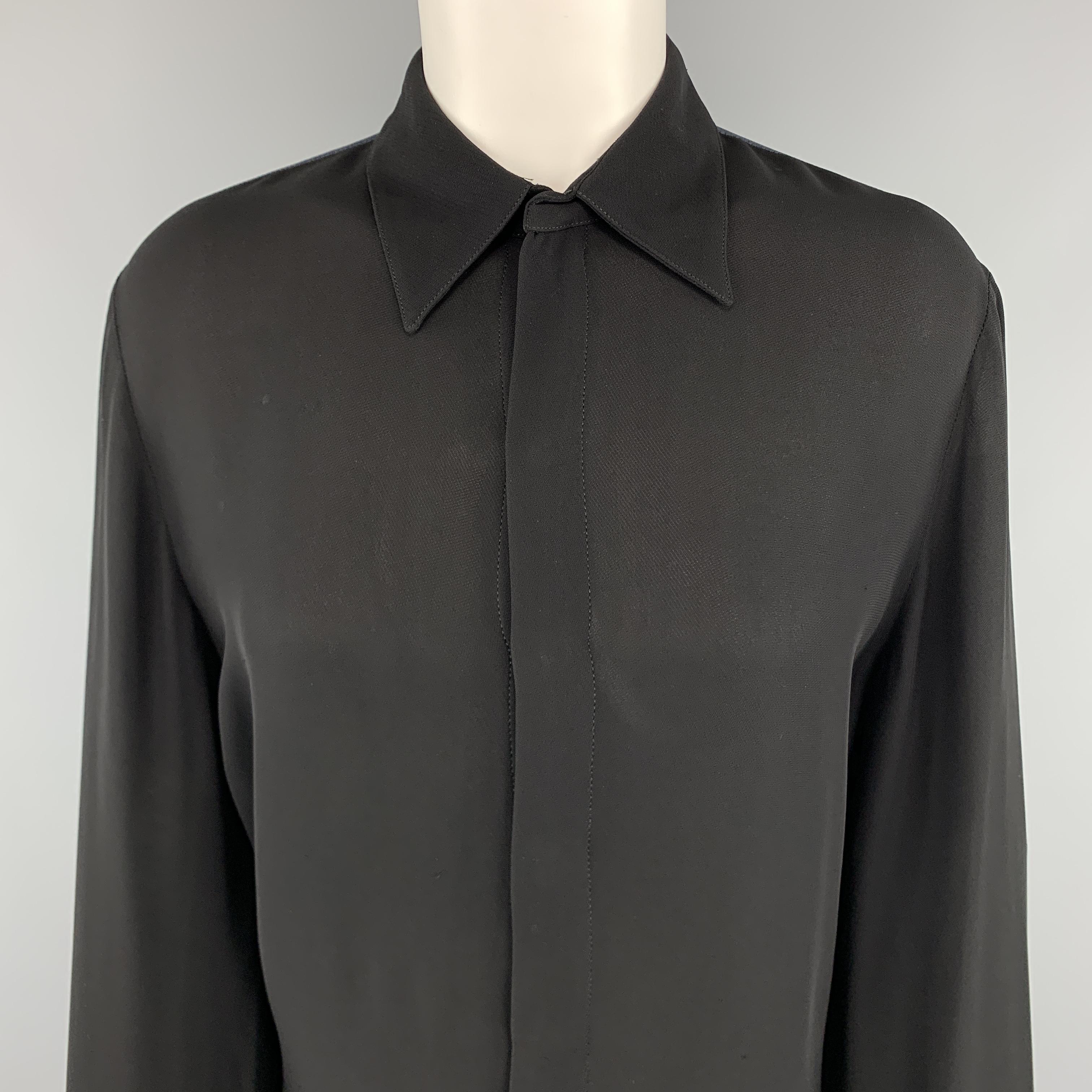 Vintage JEAN PAUL GAULTIER blouse comes in black crepe with a hidden snap placket front, pointed collar, mock French snap cuffs, and charcoal zebra hyde print back panel. Made in Italy.

Excellent Pre-Owned Condition.
Marked: