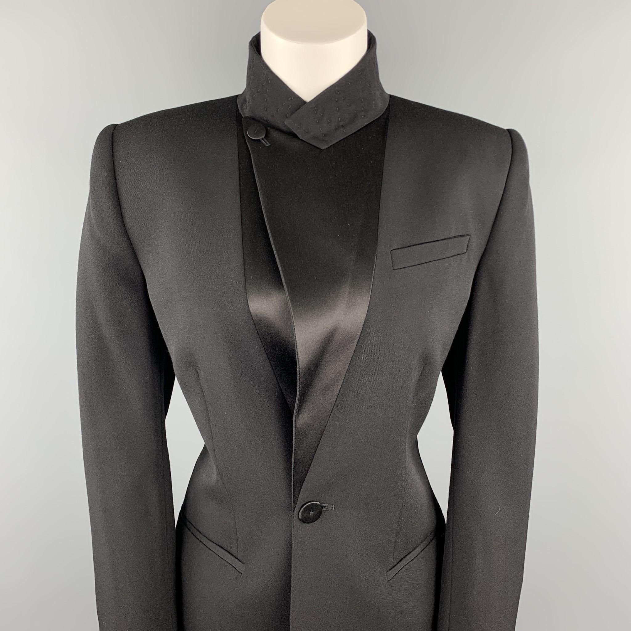 JEAN PAUL GAULTIER blazer comes in a black wool with a light pink liner featuring a peak lapel style, corset back design, and a single button closure. Made in Italy.

Excellent Pre-Owned Condition.
Marked: USA 10

Measurements:

Shoulder: 17 in.