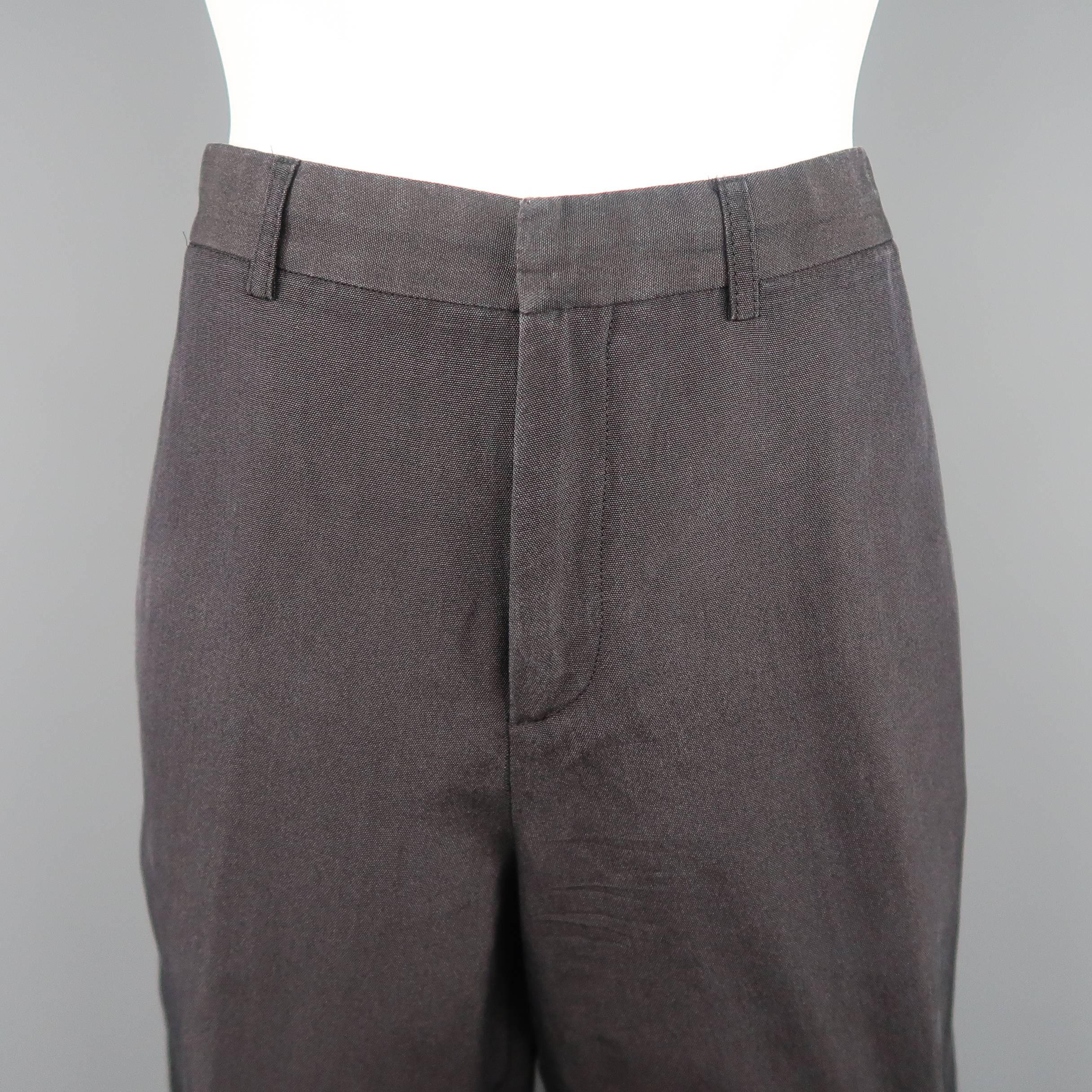 JEAN PAUL GAULTIER trousers come in washed charcoal gray canvas with a cropped hem and signature back tab. Made in Italy.
 
Good Pre-Owned Condition.
Marked: 10
 
Measurements:
 
Waist: 32 in.
Rise: 11 in.
Inseam: 20 in.
