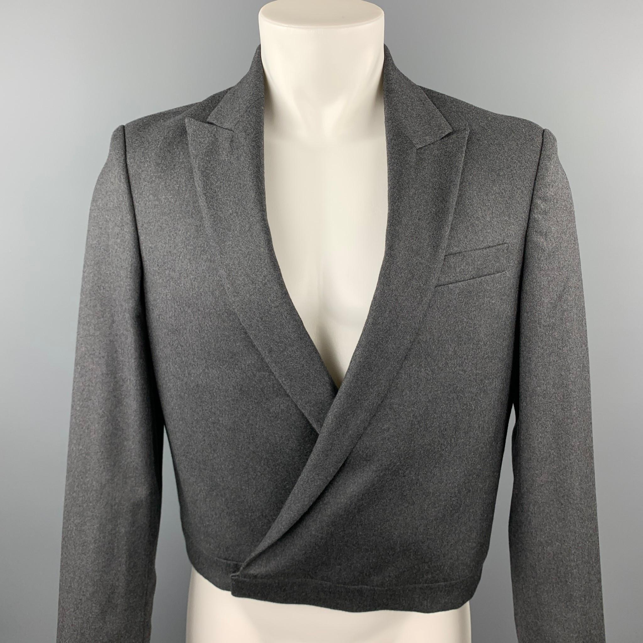 JEAN PAUL GAULTIER jacket comes in a dark gray wool / cashmere featuring a cropped style, peak lapel, and a hook & eye closure. Made in Italy.

Excellent Pre-Owned Condition.
Marked: IT 50

Measurements:

Shoulder: 18 in. 
Chest: 40 in. 
Sleeve: 27