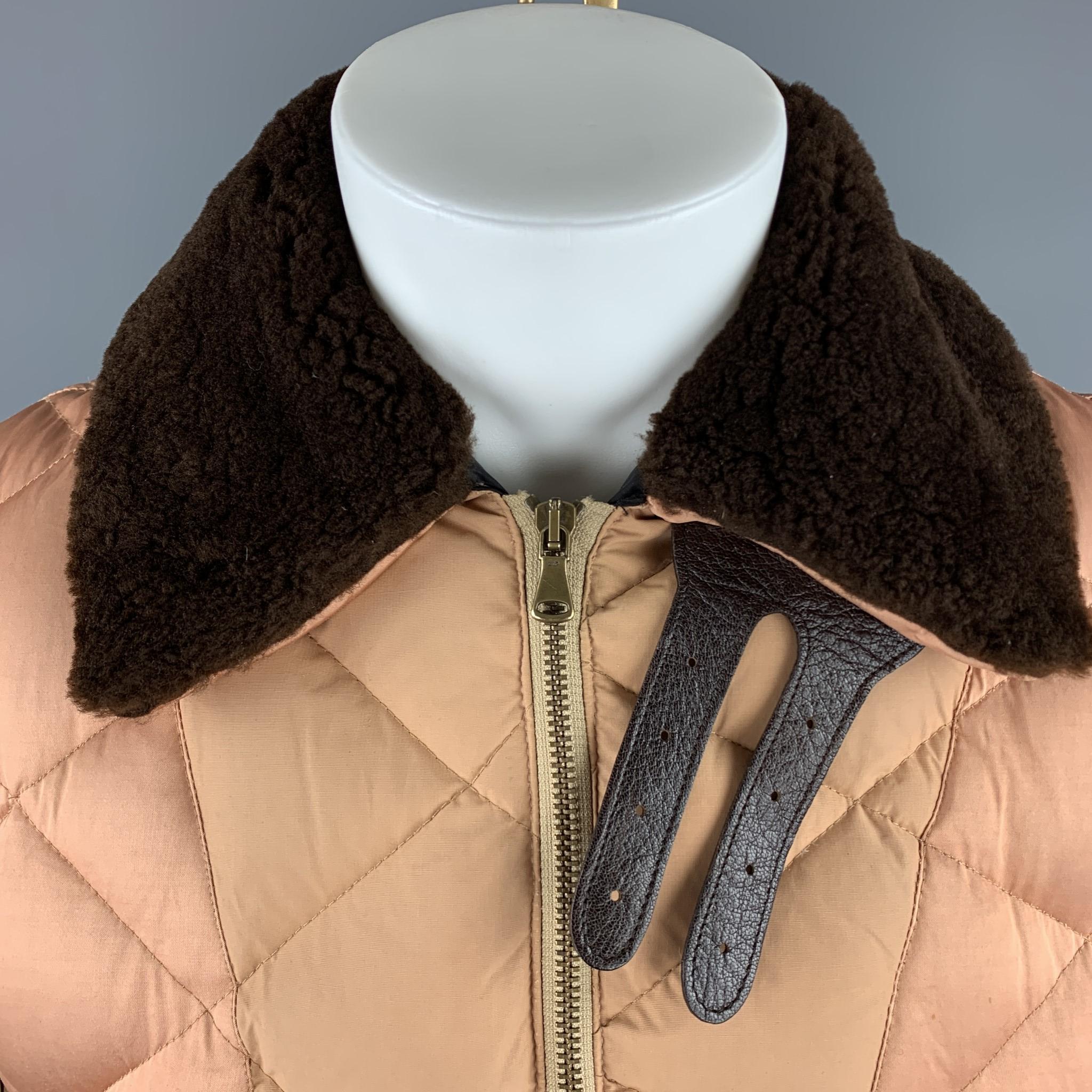 Vintage JEAN PAUL GAULTIER quilted puffer jacket comes in khaki cotton with a beige sateen shoulder panel, striped zip sleeves, double zip vent back with snap flaps, and brown faux fur collar. Made in Italy.

Very Good Pre-Owned Condition.
Marked: