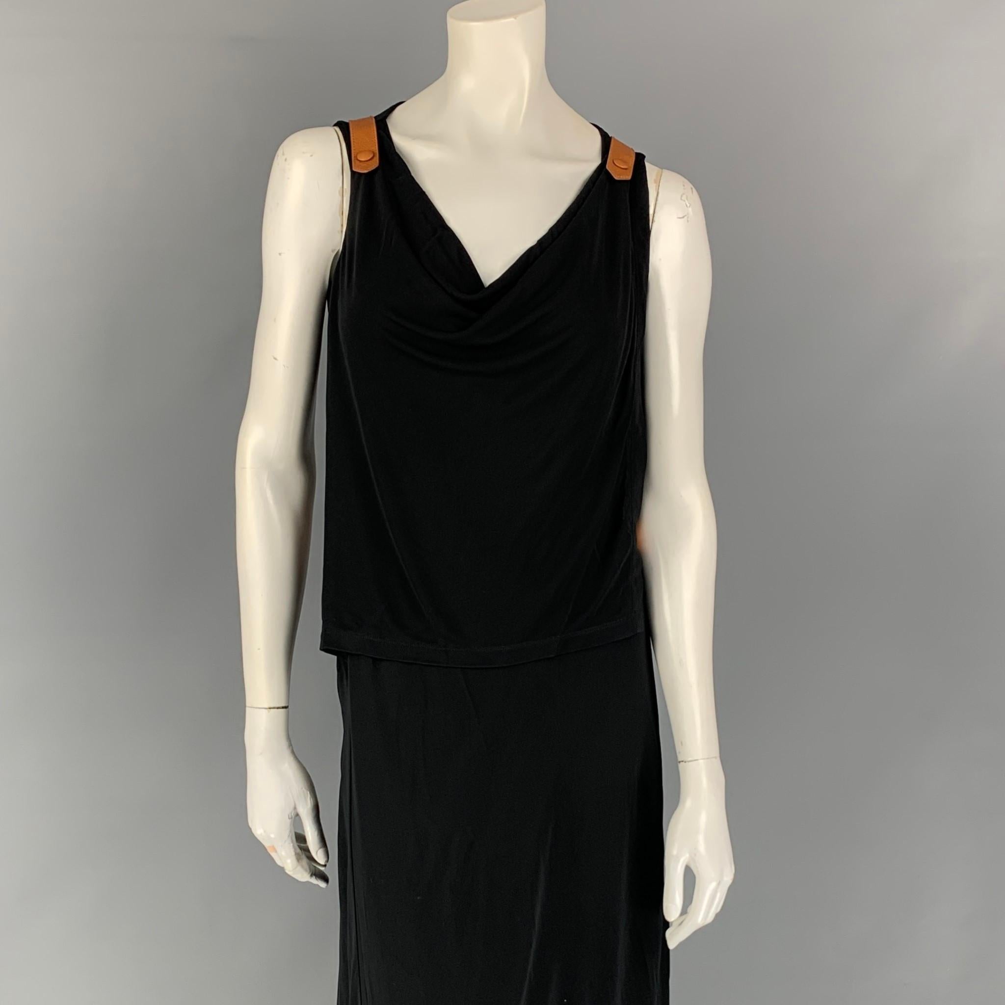 JEAN PAUL GAULTIER dress comes in a black rayon blend with tan leather strap details featuring a wrap style, sleeveless, and a front slit. 

Very Good Pre-Owned Condition.
Marked: I 40 / D 36 / F 36 / GB 8 / USA 6

Measurements:

Bust: 30 in.
Waist: