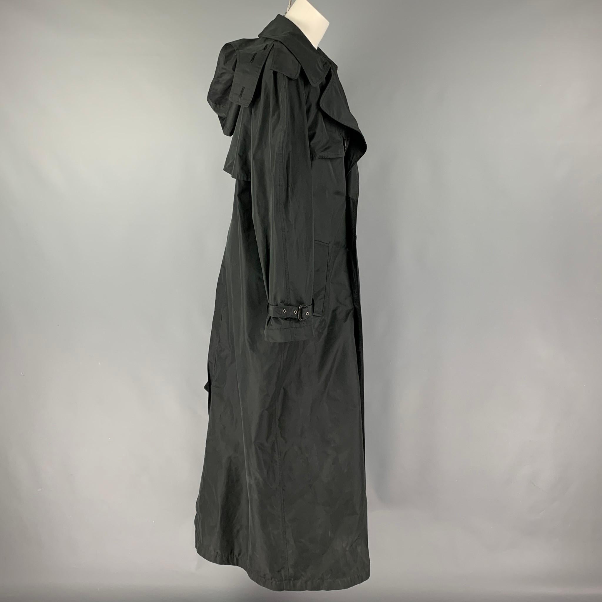 JEAN PAUL GAULTIER coat comes in a black polyester / silk featuring a large lapel, slit pockets, belted sleeve details, hooded, and a double breasted closure. Missing Belt. Made in Italy. 

Very Good Pre-Owned Condition.
Marked: I 42 / D 38 / F 38 /