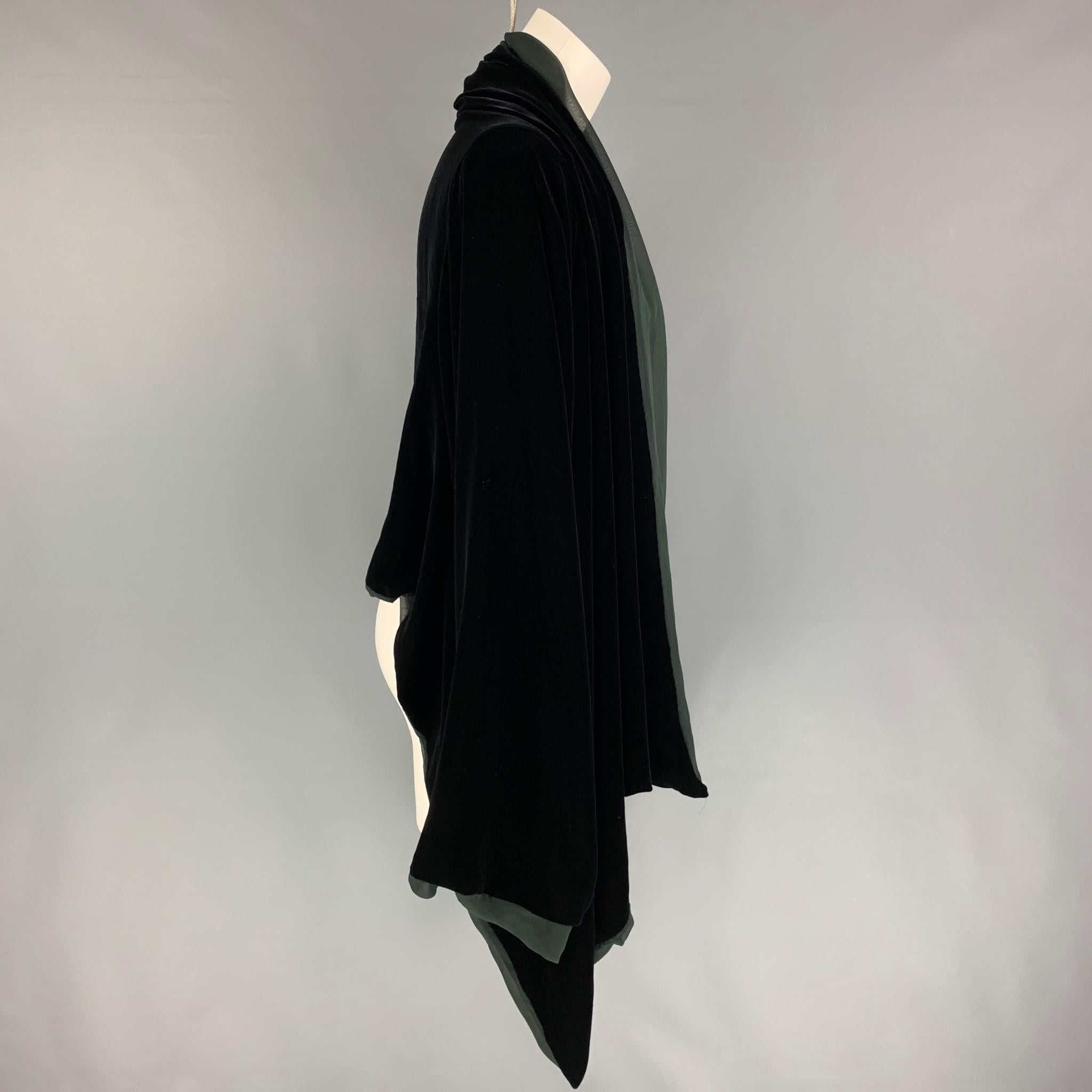 JEAN PAUL GAULTIER jacket comes in a black velvet rayon / silk with a chiffon liner featuring long sleeves, draped, and a open front. Made in Italy.

Very Good Pre-Owned Condition.
Marked: I 42 / D 38 / F 38 / GB 10 / USA 8

Measurements:

Shoulder: