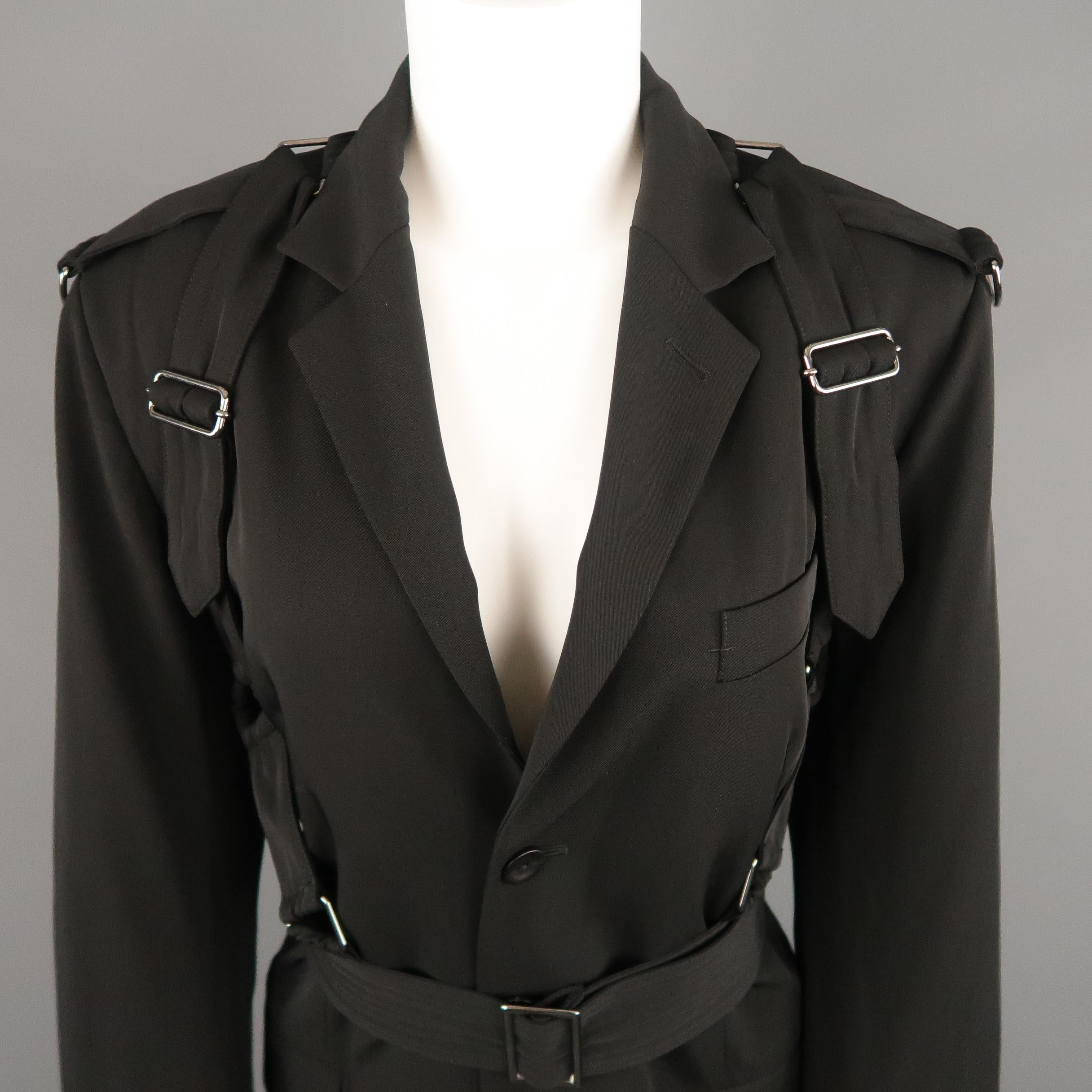 Vintage GAULTIER2 by JEAN PAUL GAULTIER blazer jacket comes in black wool twill with a notch lapel,single breasted, three button front, functional button cuffs, and bondage strap harness overlay. Made in Italy.
 
Excellent Pre-Owned