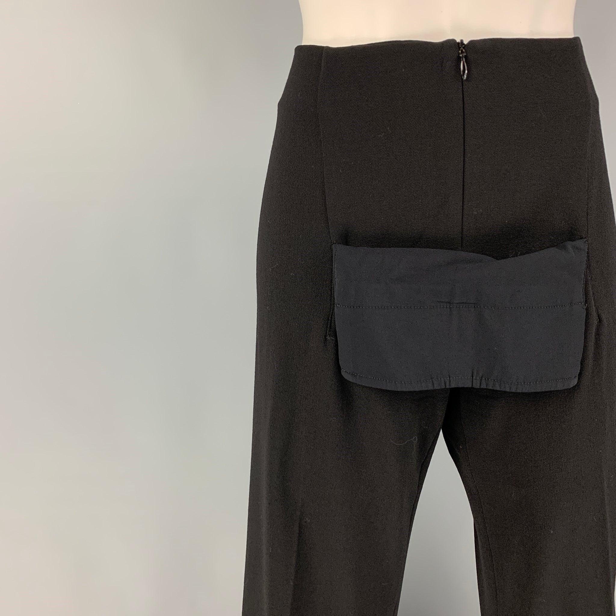JEAN PAUL GAULTIER pants comes in a black wool / polyamide featuring a front panel design, wide leg, and a front zipper closure. Made in Italy.
Very Good
Pre-Owned Condition. 

Marked:   I 42 / D 38 / F 38 / GB 10 / USA 8 

Measurements: 
  Waist: