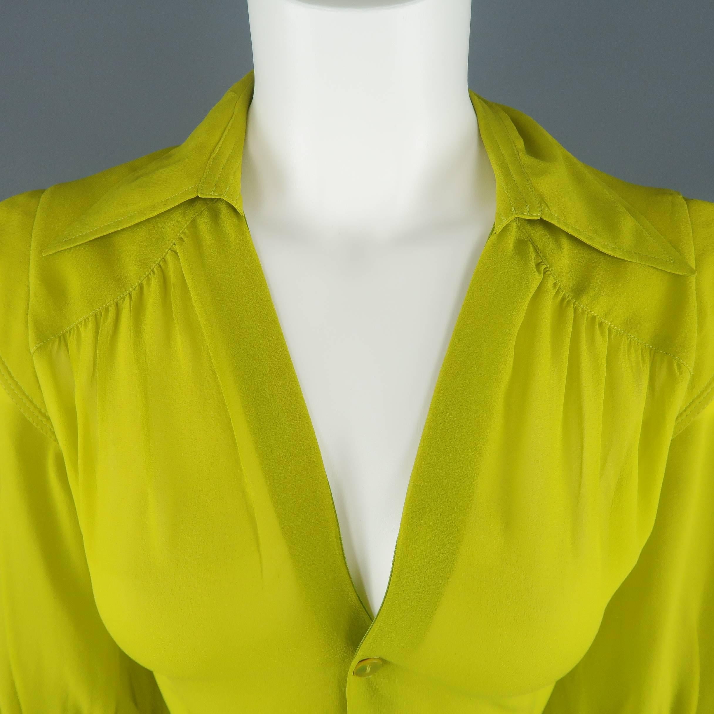 JEAN PAUL GAULTIER FEMME blouse comes in a gorgeous chartreuse yellow green silk crepe chiffon and features a pointed collar, open V neck with half button up front, gathered three quarter sleeves, and shoulder overlay detail. Made in Italy.

