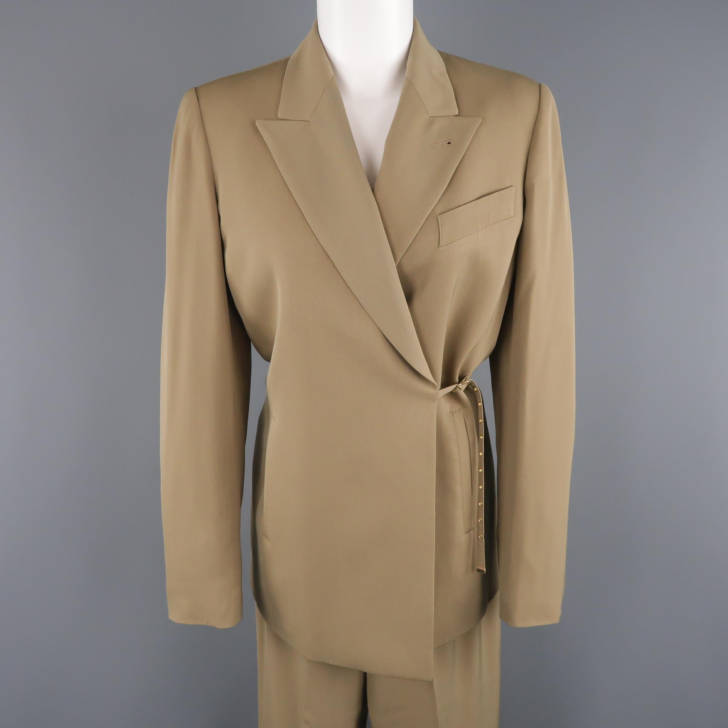 Vintage JEAN PAUL GAULTIER CLASSIQUE suit comes in khaki twill and includes a peak lapel sport jacket with wrapped belt closure front, and matching relaxed trousers. Made in Italy.
 
Excellent Pre-Owned Condition.
Marked: US 8
 
Measurements:
