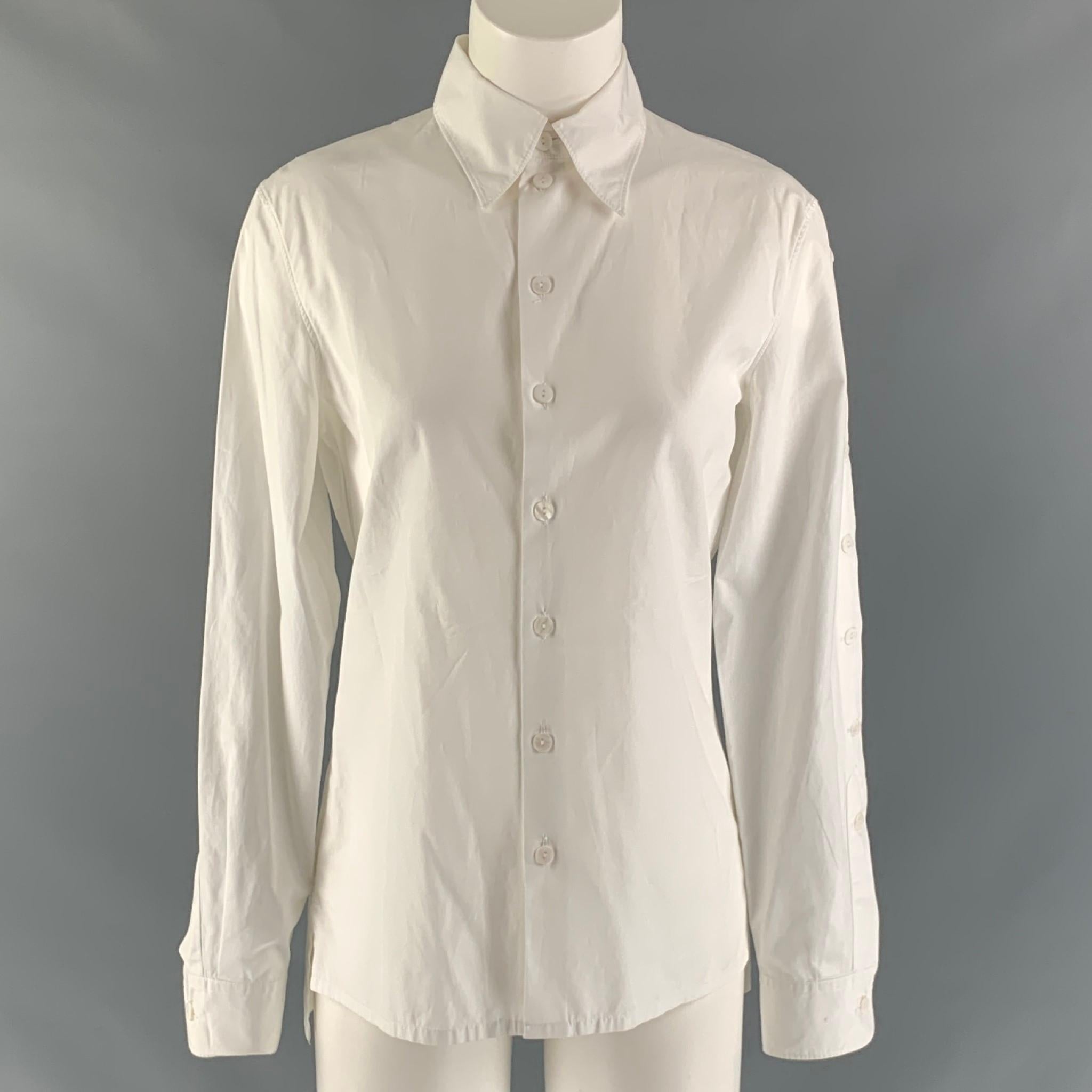VINTAGE JEAN PAUL GAULTIER long sleeve shirt comes in white cotton fabric featuring a straight collar, buttoned detail at sleeves and a button up closure. Made in Italy.

Very Good Pre-Owned Condition. Minor marks at right sleeve cuff.
Marked: