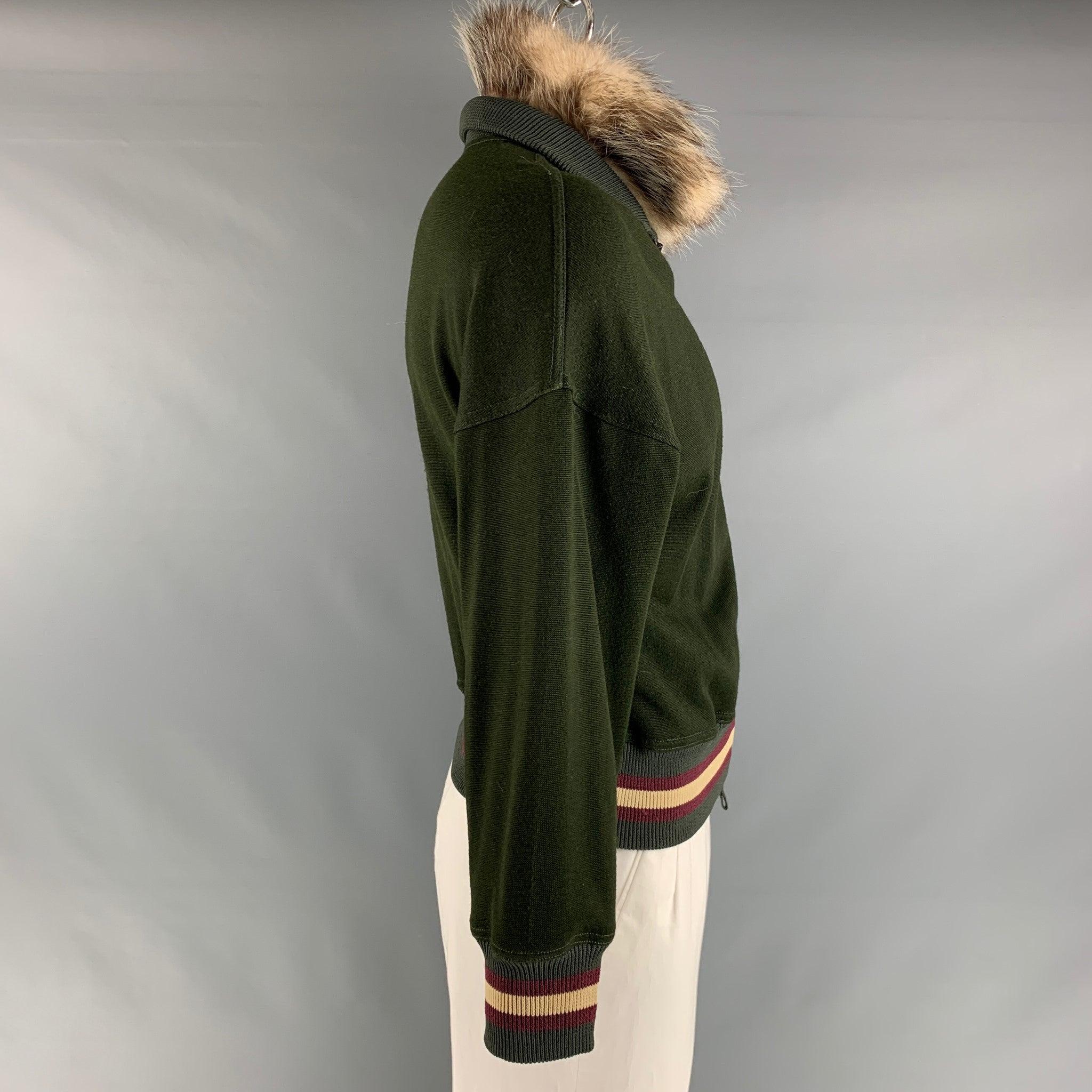 JEAN PAUL GAULTIER jacket comes in a olive viscose and cotton jersey knit material featuring a ribbed hem, drop shoulder, detachable fur collar, high neck, and a full zip up closure. Made in Italy. Very Good Pre-Owned Condition. Minor signs of wear.