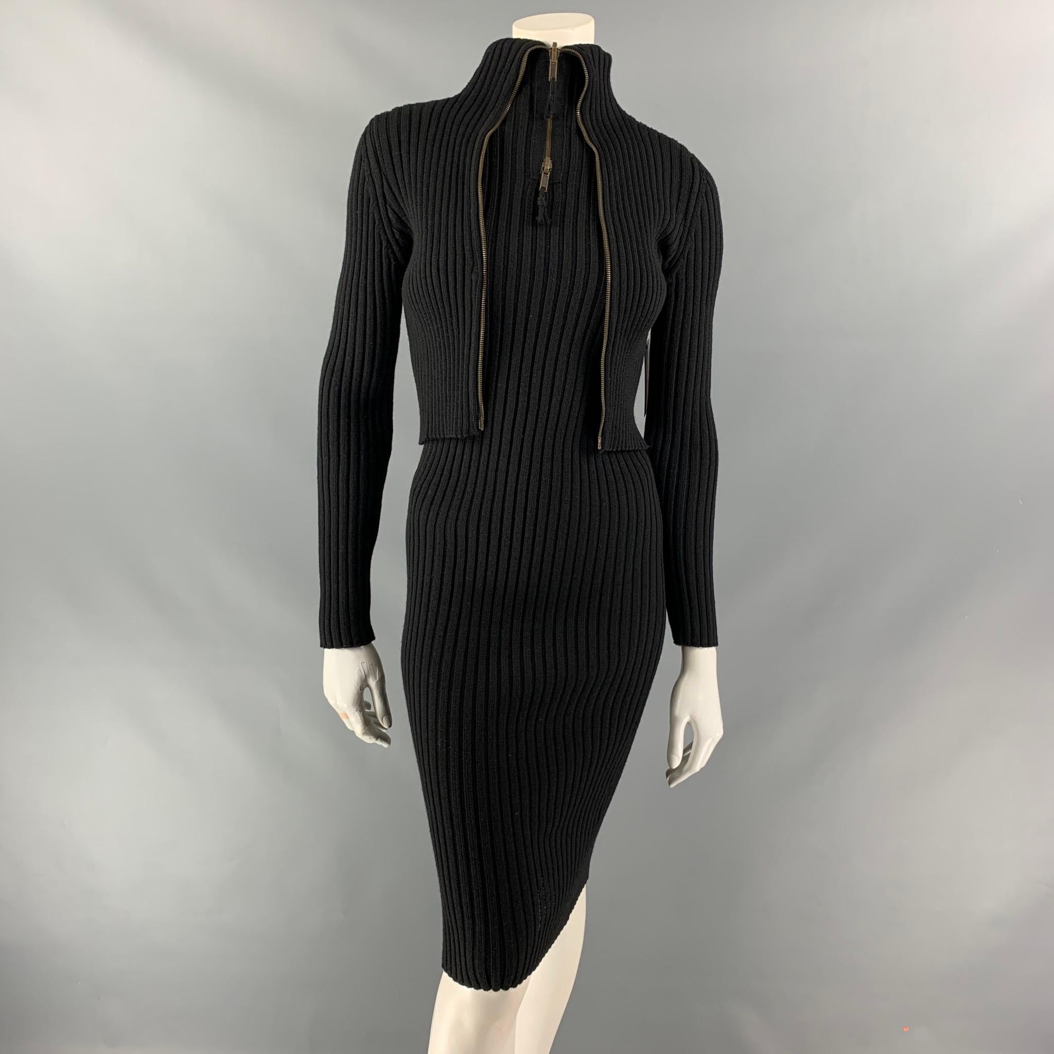 VINTAGE JEAN PAUL GAULTIER classique long sleeve midi bodycon stretch dress comes in black ribbed knit wool featuring an attached jacket and full zip at front. Made Italy.

Very Good Pre-Owned Condition. Minor repaired at back.
Marked: