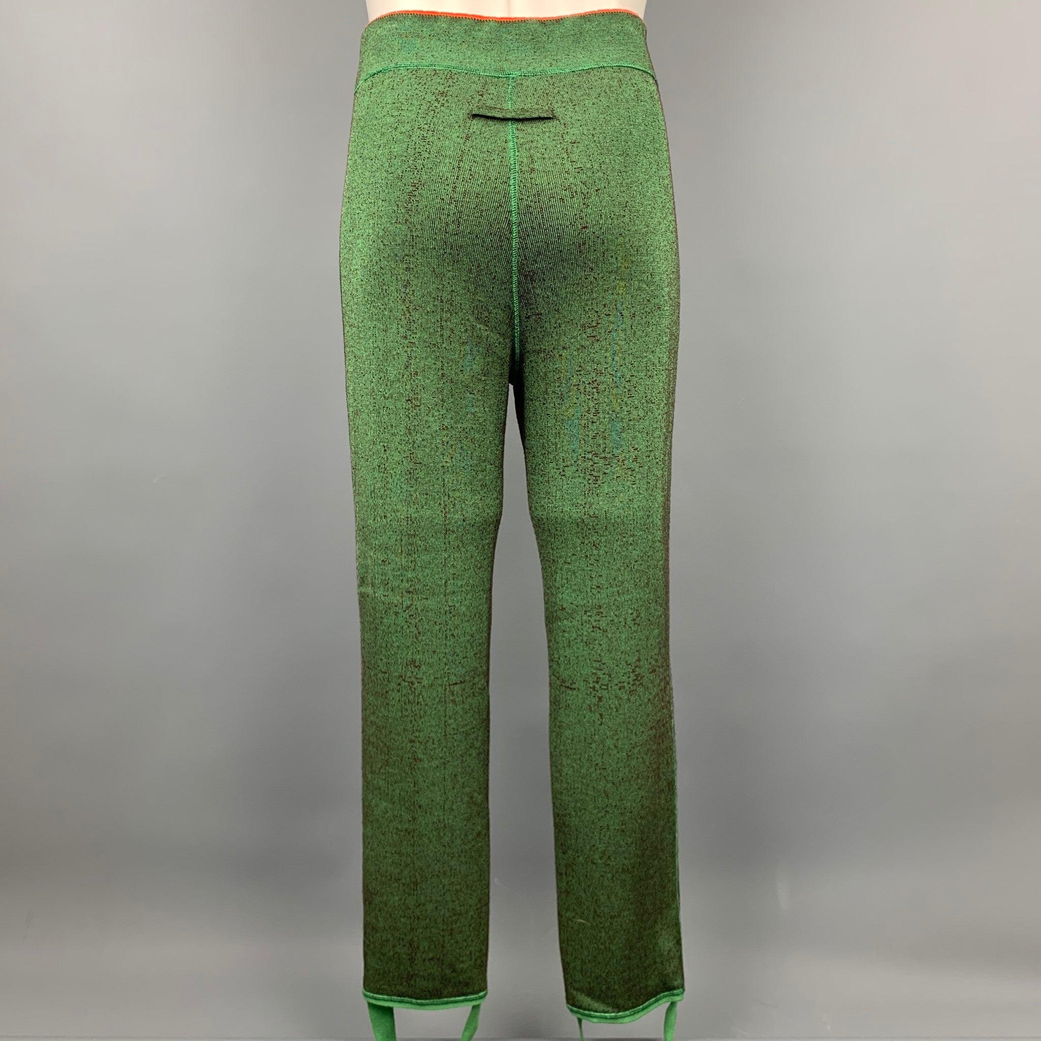 JEAN PAUL GAULTIER sweatpants comes in a green & orange textured material featuring a reversible style, leg straps, elastic waistband, and signature gaultier back tab design.
Very Good
Pre-Owned Condition. 

Marked:   No brand, no size, no care tag