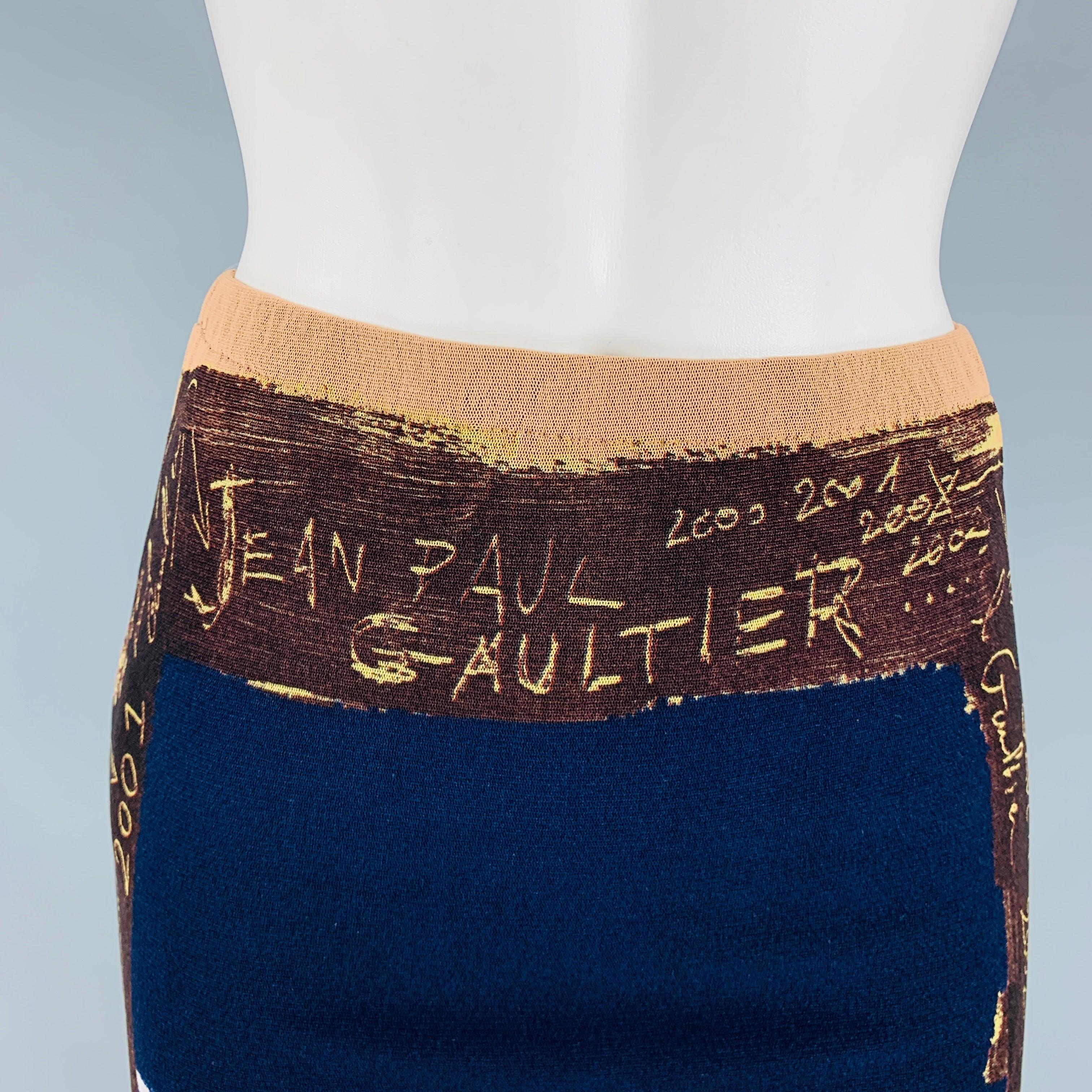 JEAN PAUL GAULTIER 
SS 2001 Graffiti Collectors skirt comes in a navy and multicolor nylon mesh knit material featuring a pencil style. Made in Italy.Excellent Pre-Owned Condition. 

Marked:   M 

Measurements: 
  Waist: 25 inches Hip: 30 inches