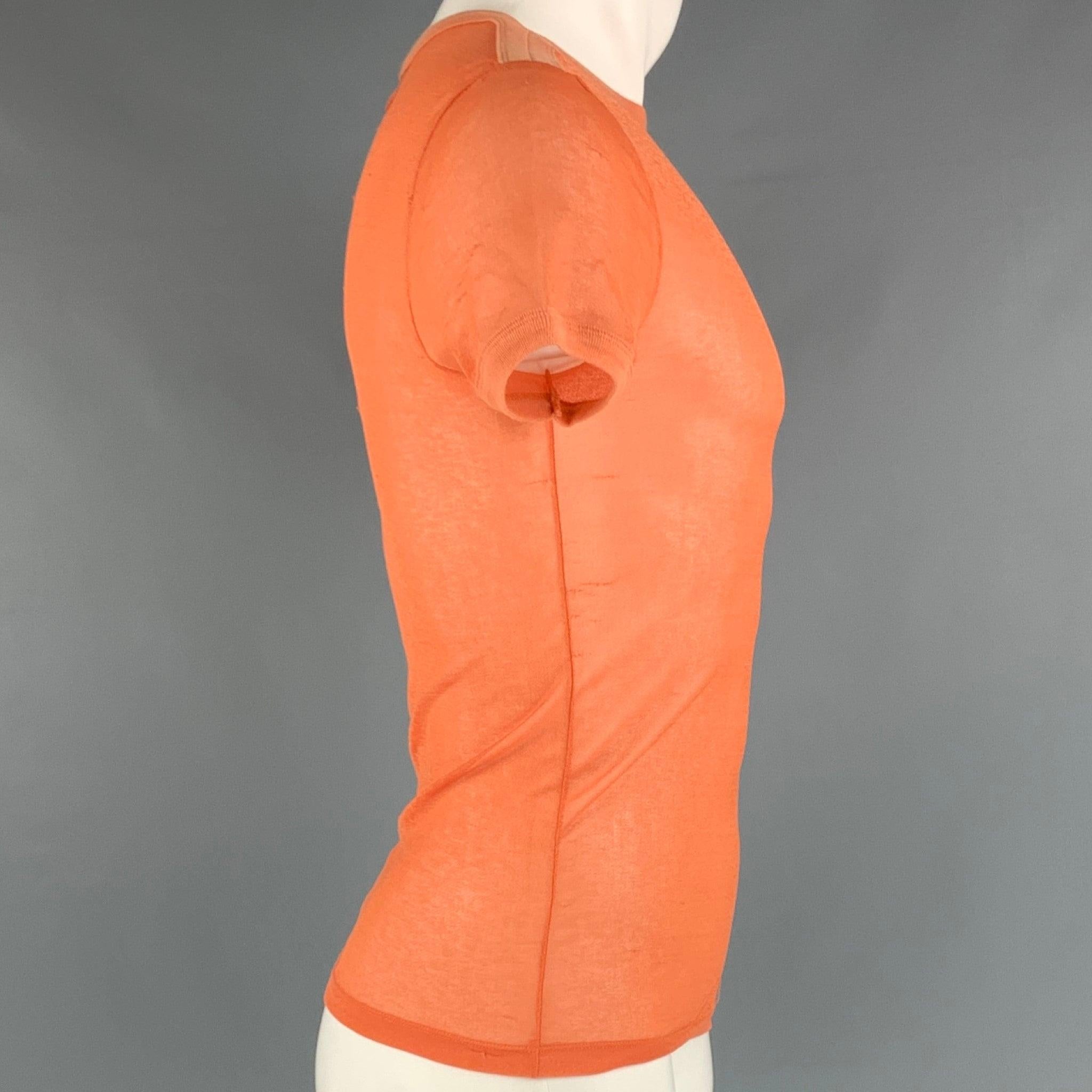JEAN PAUL GAULTIER T-shirt in an orange polyester fabric featuring a sheer style and short sleeves. Made in Italy.
Good Pre-Owned Condition. Moderate signs of wear, please check photos. 

Marked:   size not marked
 

Measurements: 
 
Shoulder: 15.5