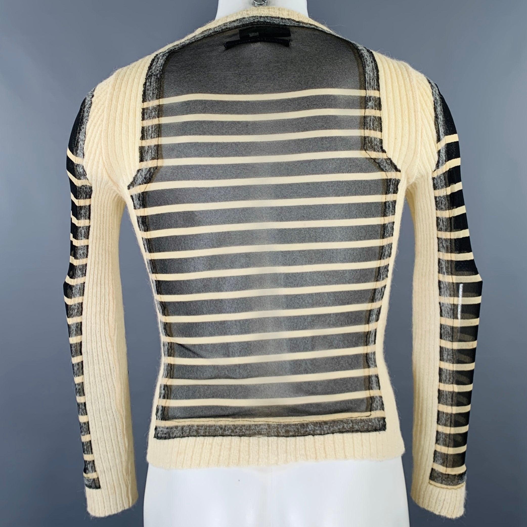 Vintage JEAN PAUL GAULTIER pullover
in black and cream polyamide featuring a cream alpaca trim, stripe pattern, and crew neck. Made in Italy.Good Pre-Owned Condition. Moderate marks on front, as is. 

Marked:   S 

Measurements: 
 
Shoulder: 15
