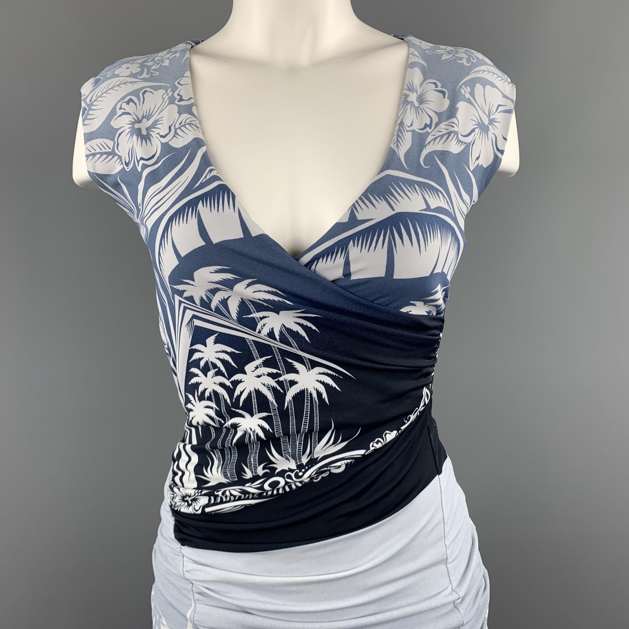 JEAN PAUL GAULTIER shift dress comes in a blue ombre tropical pattern jersey with a wrapped drape V neck and signature tab back. Made in Italy.

Excellent Pre-Owned Condition.
Marked: S

Measurements:

Shoulder: 15 in.
Bust:  34 in.
Waist: 26