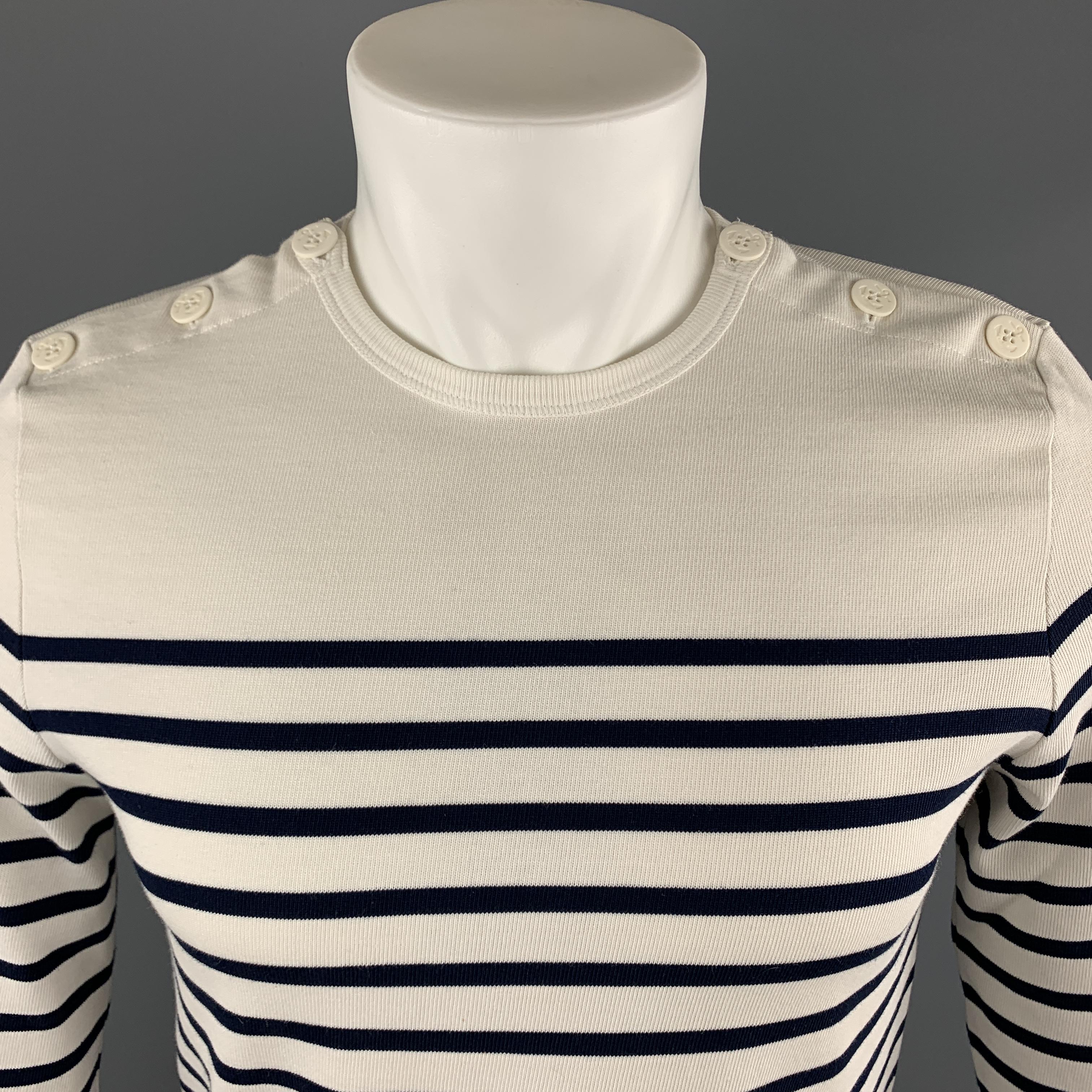 Vintage JEAN PAUL GAULTIER MATELOT nautical pullover comes in white cotton with navy stripes and anchor button shoulders. Made in Portugal.

Excellent Pre-Owned Condition.
Marked: (no size)

Measurements:

Shoulder: 15 in.
Chest: 38 in.
Sleeve: 24