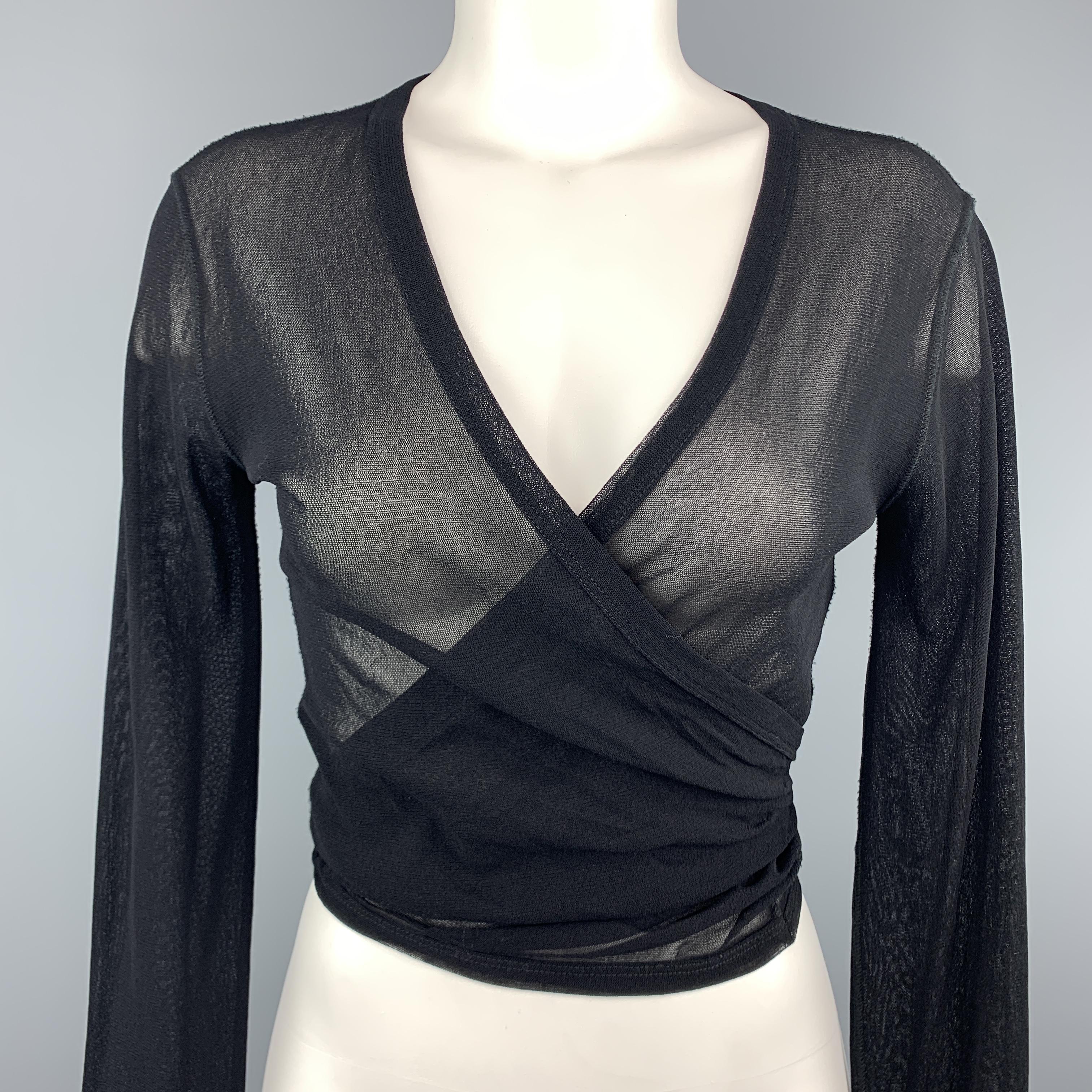 JEAN PAUL GAULTIER cardigan top comes in black stretch micro mesh ling long sleeves, wrapped V neck that ties, and signature back tab. Made in Italy.
 
Excellent Pre-Owned Condition.
Marked: XL
 
Measurements:
 
Shoulder: 15 in.
Bust: 40 in.
Sleeve: