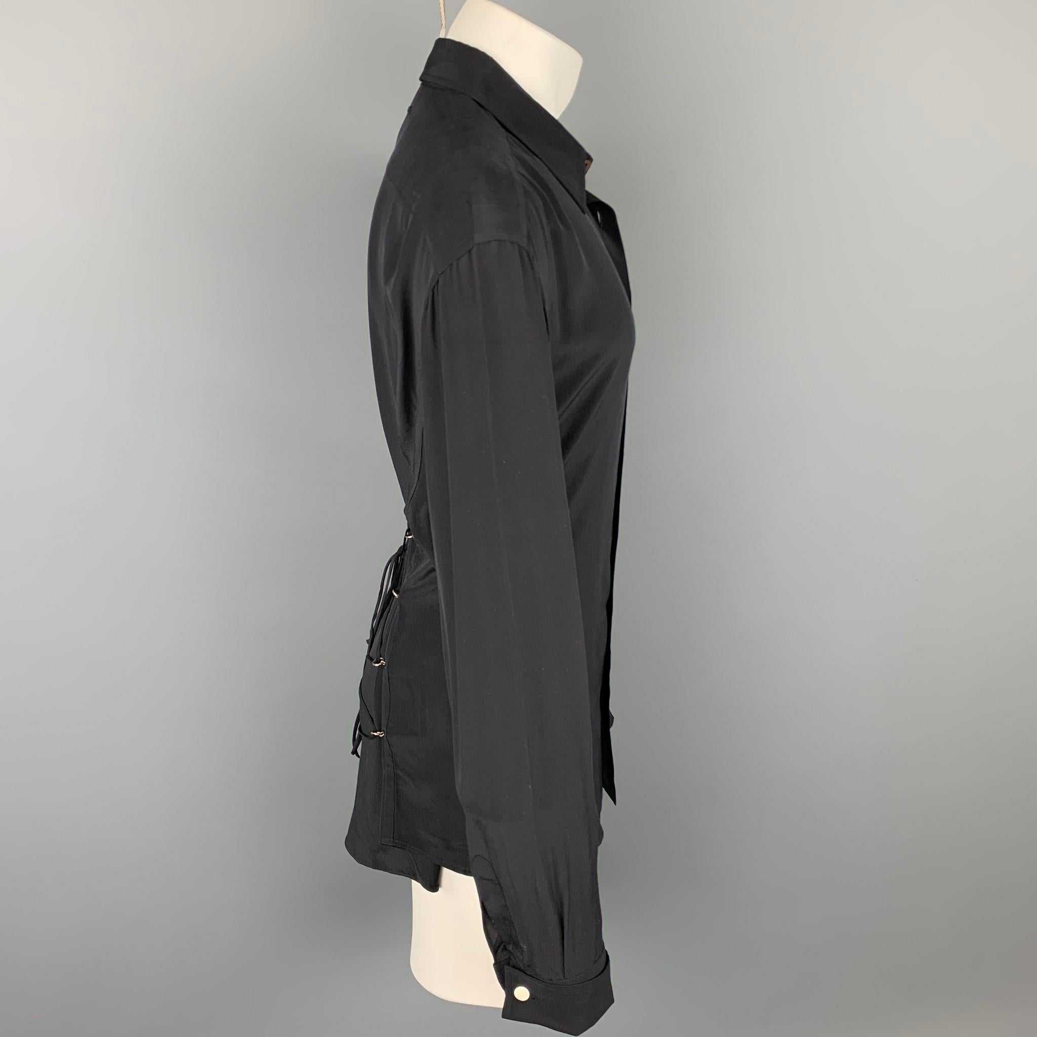 JEAN PAUL GAULTIER long sleeve shirt comes in a black silk featuring a corset back, french cuffs, front patch pocket, spread collar, and a button up closure. Made in Italy.

Very Good Pre-Owned Condition.
Marked: 44

Measurements:

Shoulder: 21