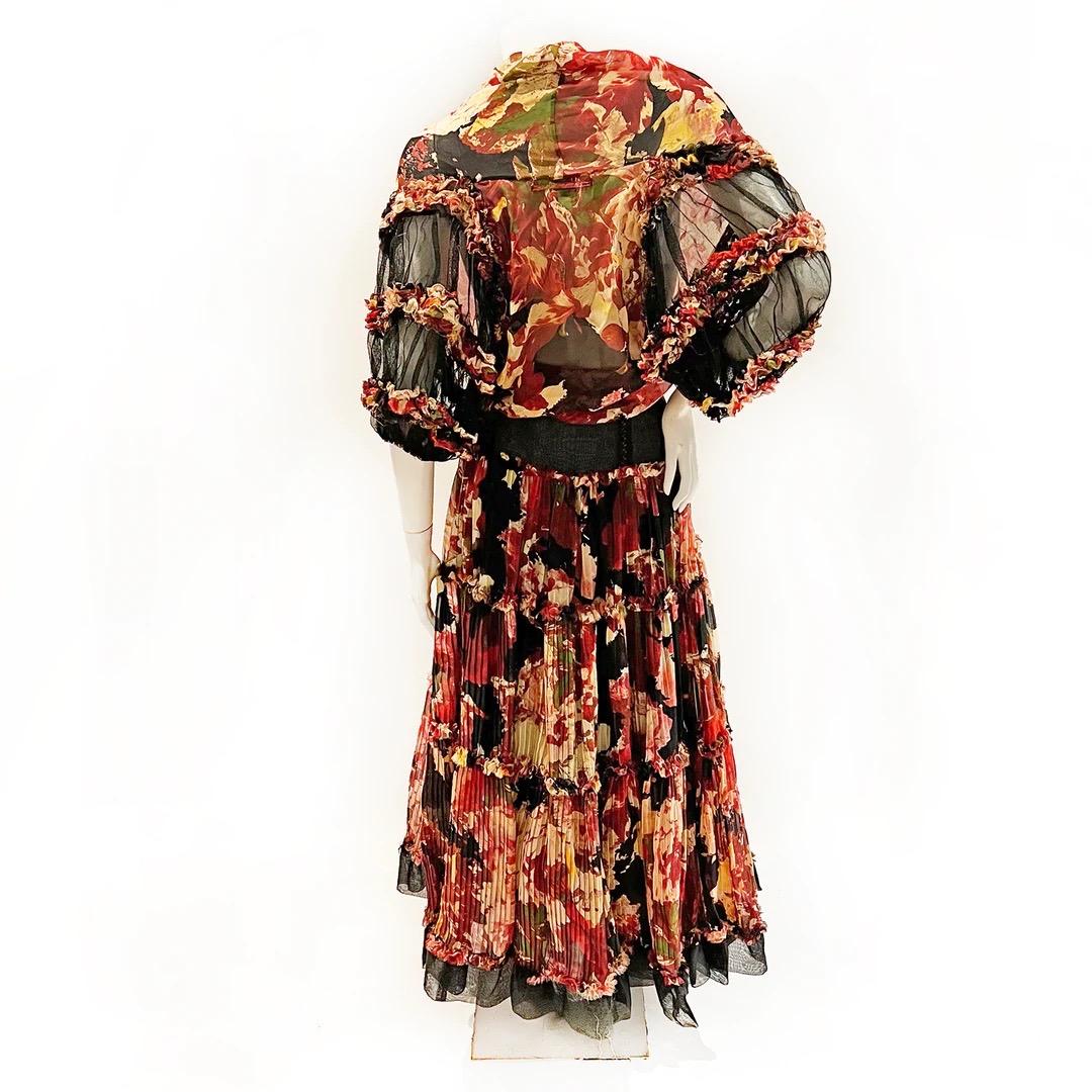 Jean Paul Gaultier Skirt and Top Set 
Spring / Summer 2006 Ready-to-Wear 
Made in Italy 
Black, red, pink, green and yellow floral print 
Silk chiffon 
Cropped wrap style top 
Draped neckline 
Blouson sleeves with black tulle and chiffon ruffles