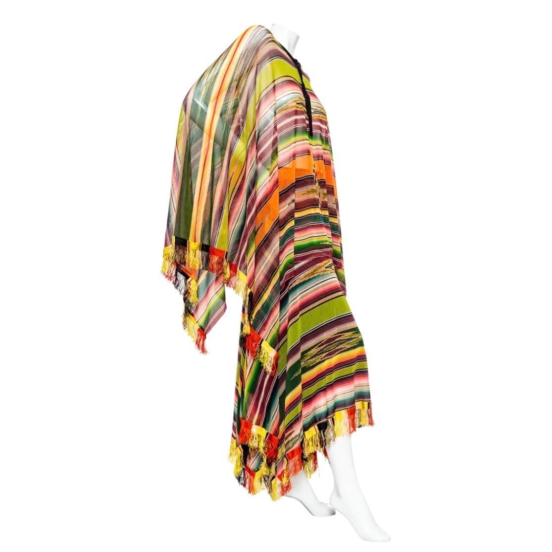 Jean Paul Gaultier Soleil Mesh Poncho and Skirt Set

Vintage
Multicolored; vibrant serape inspired pattern
Soleil label
Set includes poncho and skirt
Poncho features a black placket, fringe, and horizontal striping
Skirt features an elasticized pull