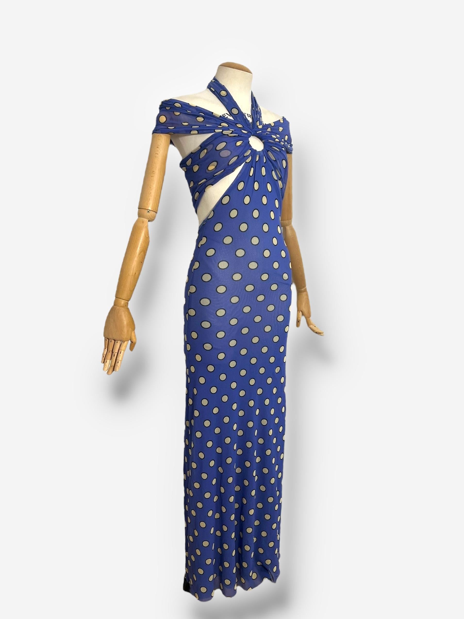 
This iconic Jean Paul Gaultier dress from the Spring/Summer 1999 “Soleil” collection features a striking cutout design paired with classic polka dot mesh fabric. The pattern is a hallmark of Gaultier’s signature style and was revisited in his 2006
