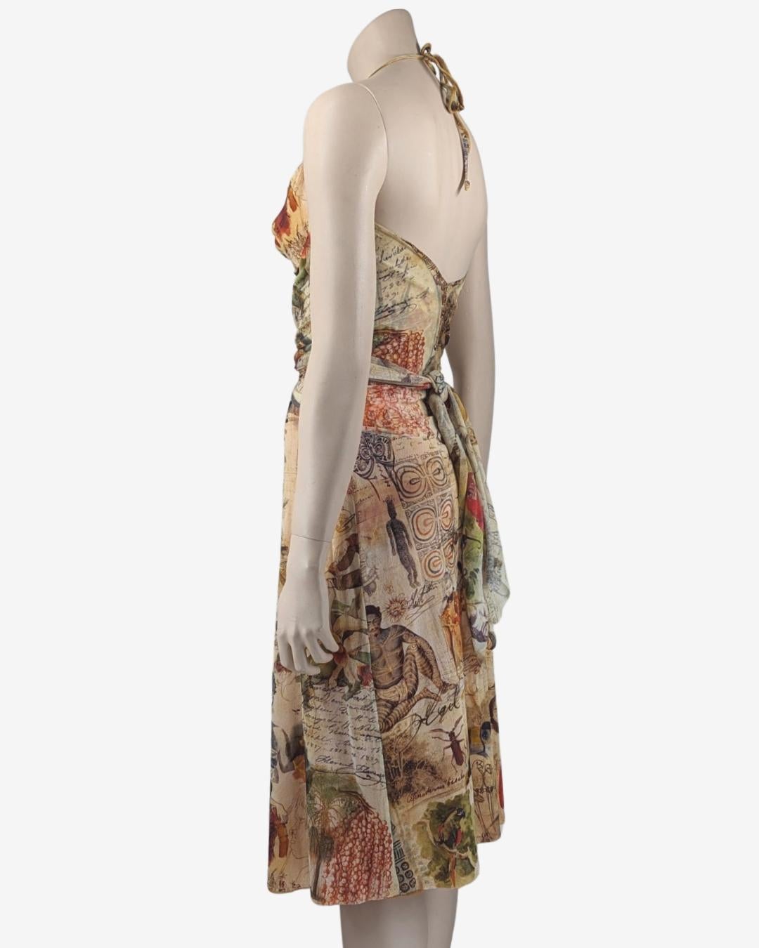 Jean Paul Gaultier Mesh Dress featuring drawings and writtings. 
Rare Tribal Parrot Native Indian detailed print.

. Vintage 90s Gaultier
. Mesh Sheer halter top midi dress
. Can be worn and tied several different ways
. Cowl neckline

Fits S, small