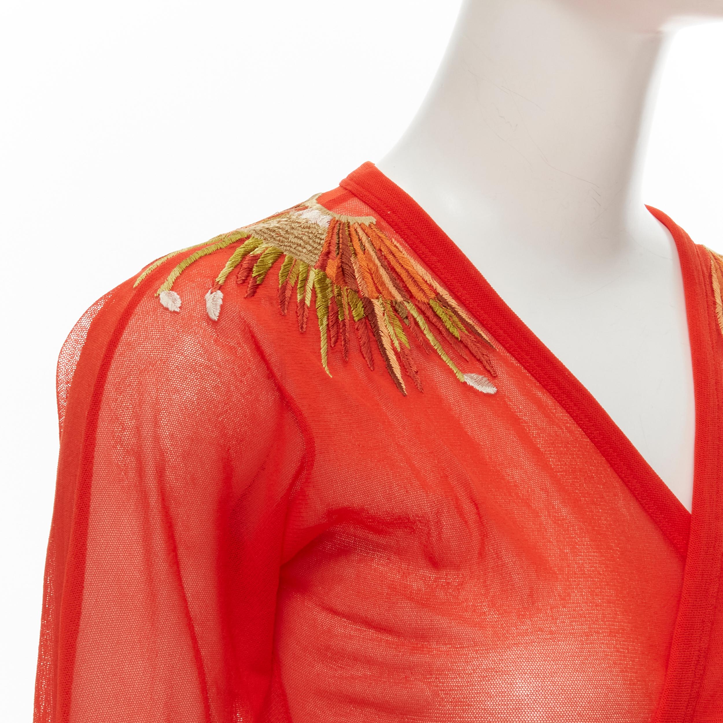 JEAN PAUL GAULTIER Soleil Vintage red polyamide feather embroidery wrap top S 
Reference: TGAS/C01042 
Brand: Jean Paul Gaultier 
Material: Polyamide 
Color: Red 
Pattern: Solid 
Closure: Tie Extra Detail: Wrap tie front. Green feather embroidery