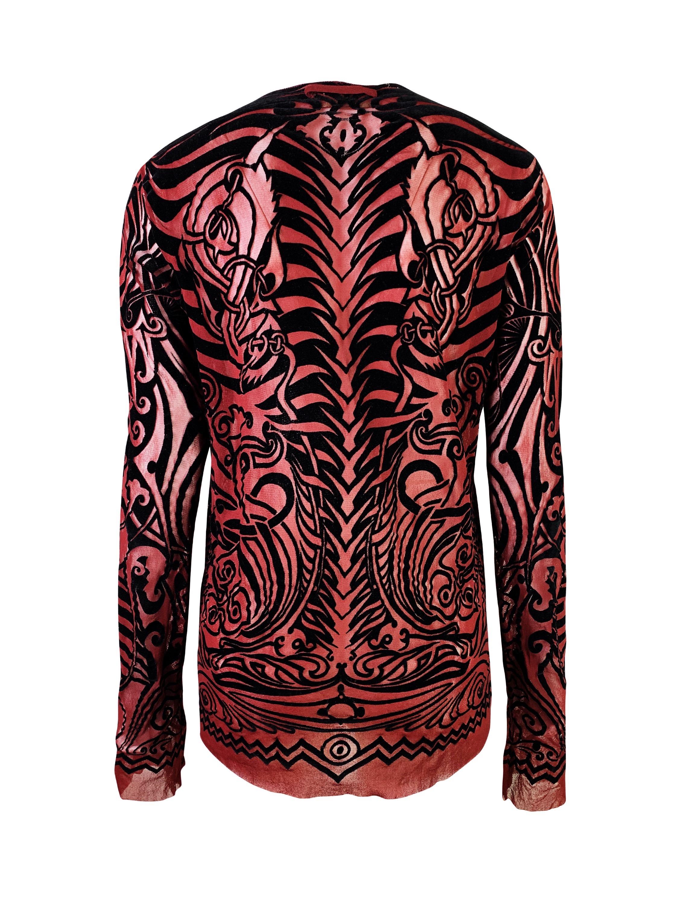 The iconic tribal tattoo mesh top with velvet finishing in size XL, recommended for sizes M-XL, will be also great for a tall person.

Very good vintage condition with minimal non-obtrusive cracking on the velvet.