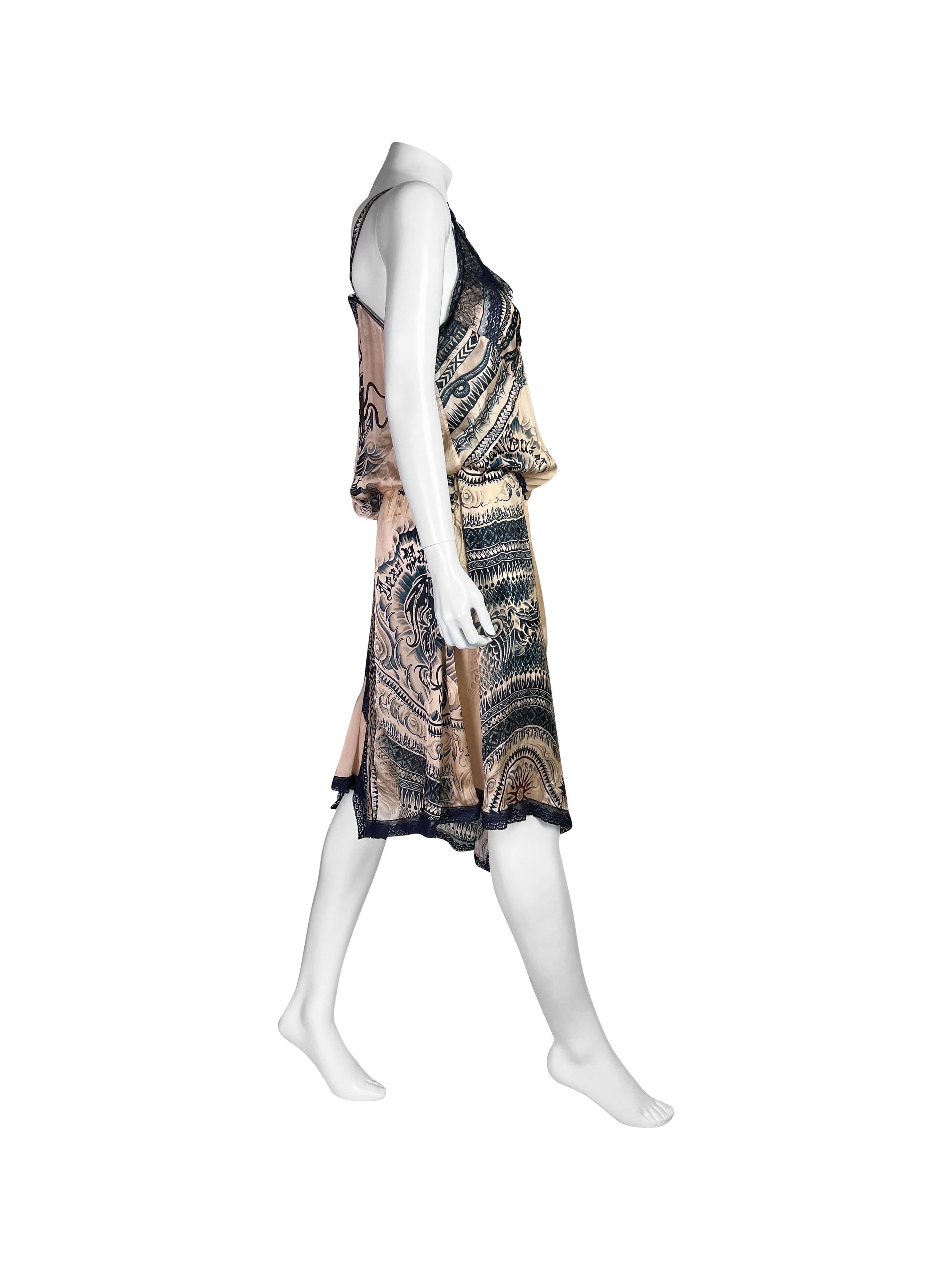 New With Tags, amazing, size flexible 100% silk dress with an iconic Jean-Paul Gaultier Nautical Tattoo Print, signature for the collection.

Thanks it’s tie-up waist, can be styled in various ways and is larger sizes friendly too.

Size IT 42,