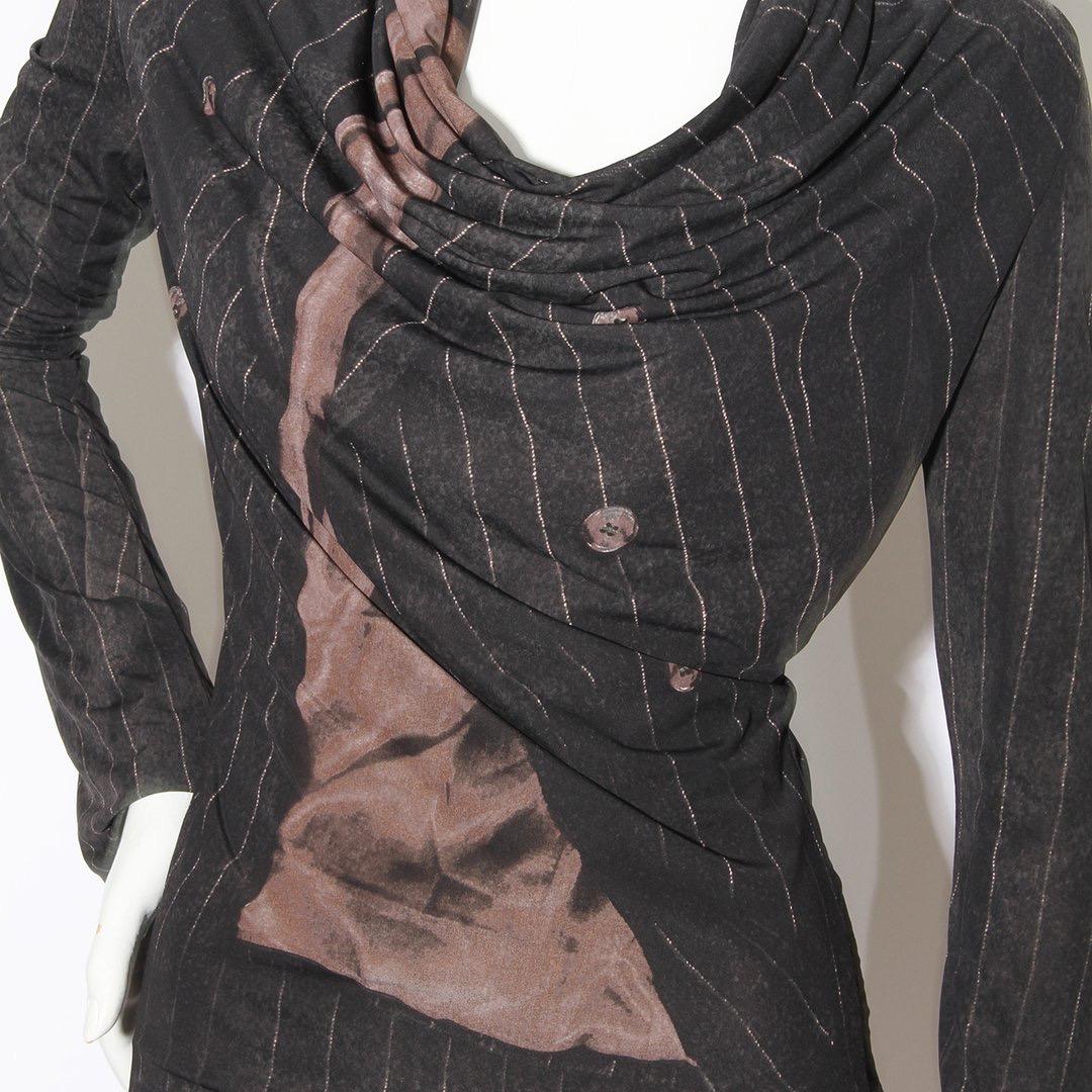 Jacket print blouse by Jean Paul Gaultier 
Fall/winter 2004 RTW
Faux stripe jackt print 
Cowl neck 
Slip on 
Long sleeve 
100% polyblend 
Made in Italy
Condition: Excellent, little to no visible wear. (see photos) 

Size/Measurements: (approximate,