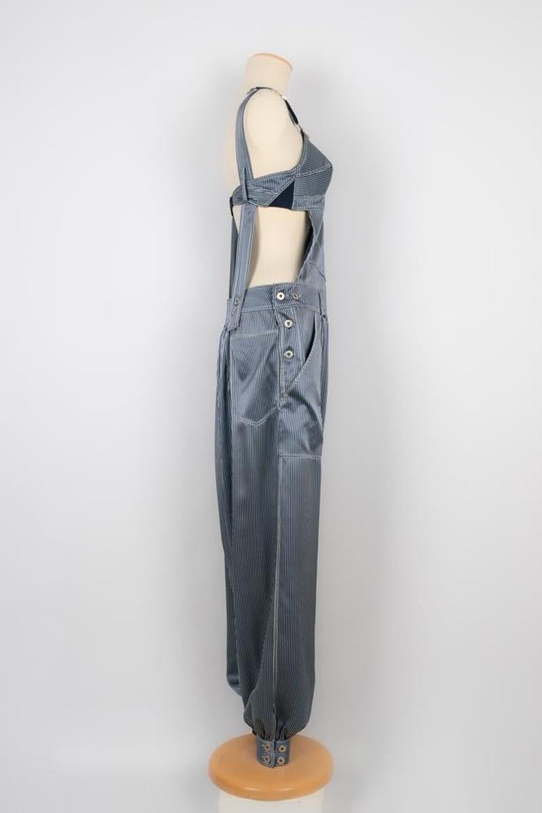 Jean-Paul Gaultier - (Made in Italy) Striped silk jumpsuit in blue tones. 36FR size indicated. 2012 Spring-Summer Collection.

Additional information:
Condition: Very good condition
Dimensions: Chest: 37 cm - Waist: 36 cm - Length: 146 cm
Period: