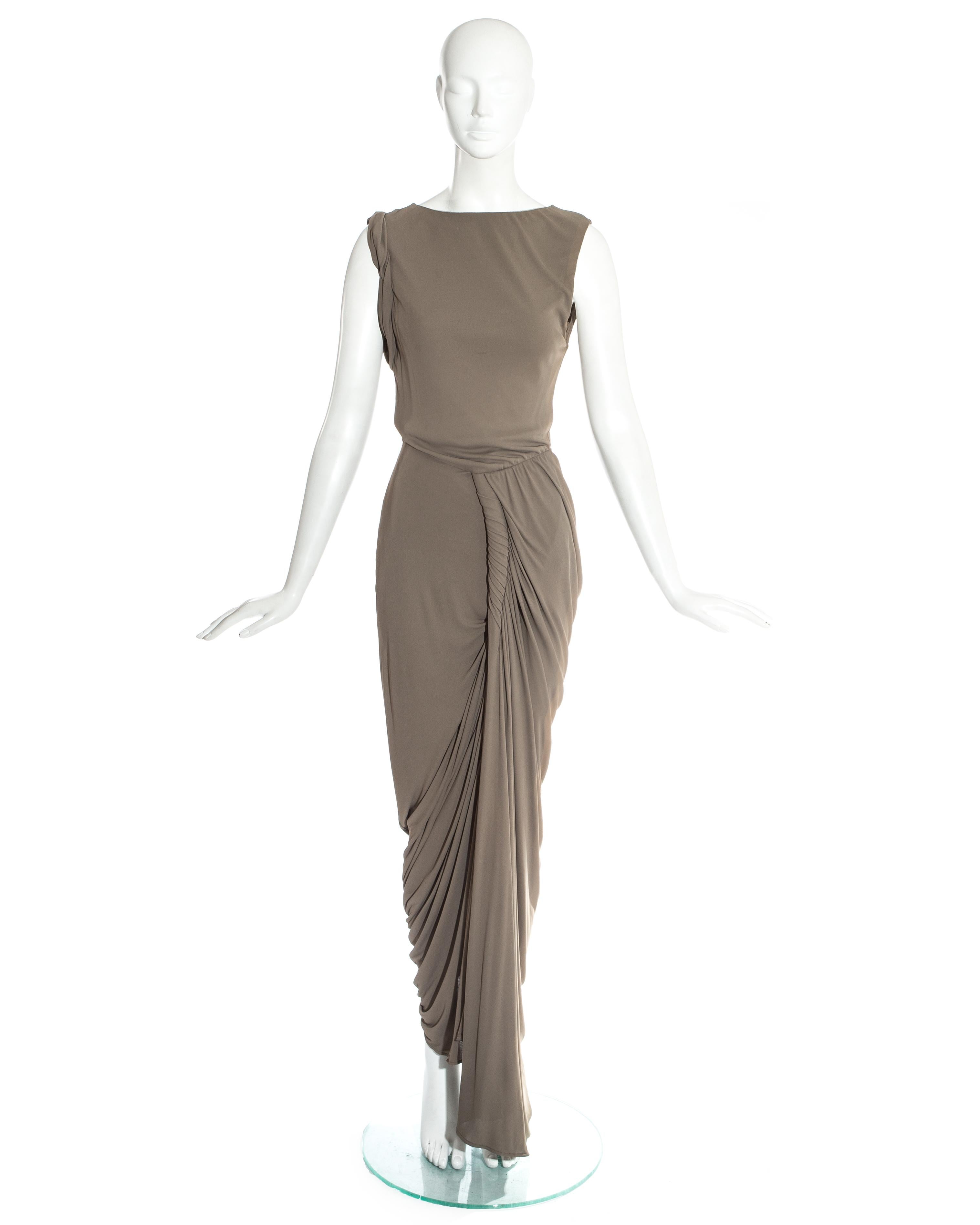 Jean Paul Gaultier taupe evening maxi dress with twisted draped skirt, rolled sleeve and leg slit. 

Spring-Summer 2009