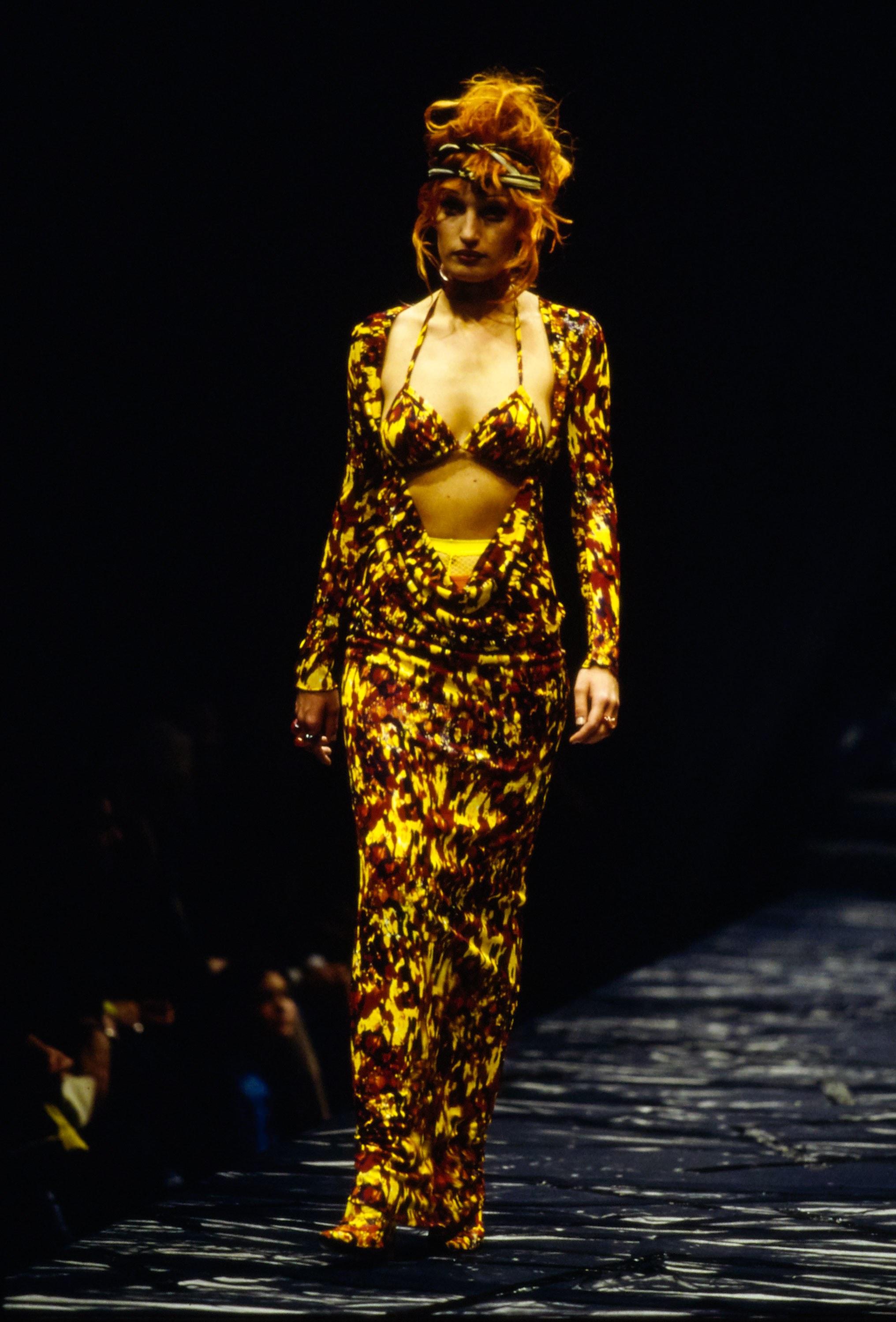 Jean Paul Gaultier tortoise shell print evening dress with open front and matching bra.

Spring-Summer 1997
