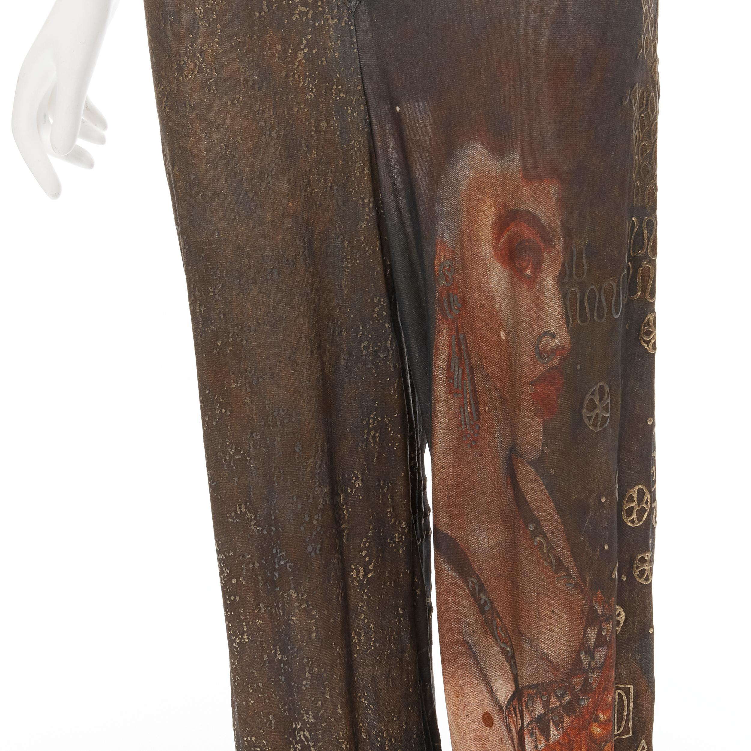 JEAN PAUL GAULTIER Vintage 1989 Klimt ethnic face print jumpsuit IT38 S 
Reference: CNLE/A00149 
Brand: Jean Paul Gaultier 
Designer: Jean Paul Gaultier 
Collection: 1980's 
Material: Viscose 
Color: Brown 
Pattern: Abstract 
Closure: Button Extra