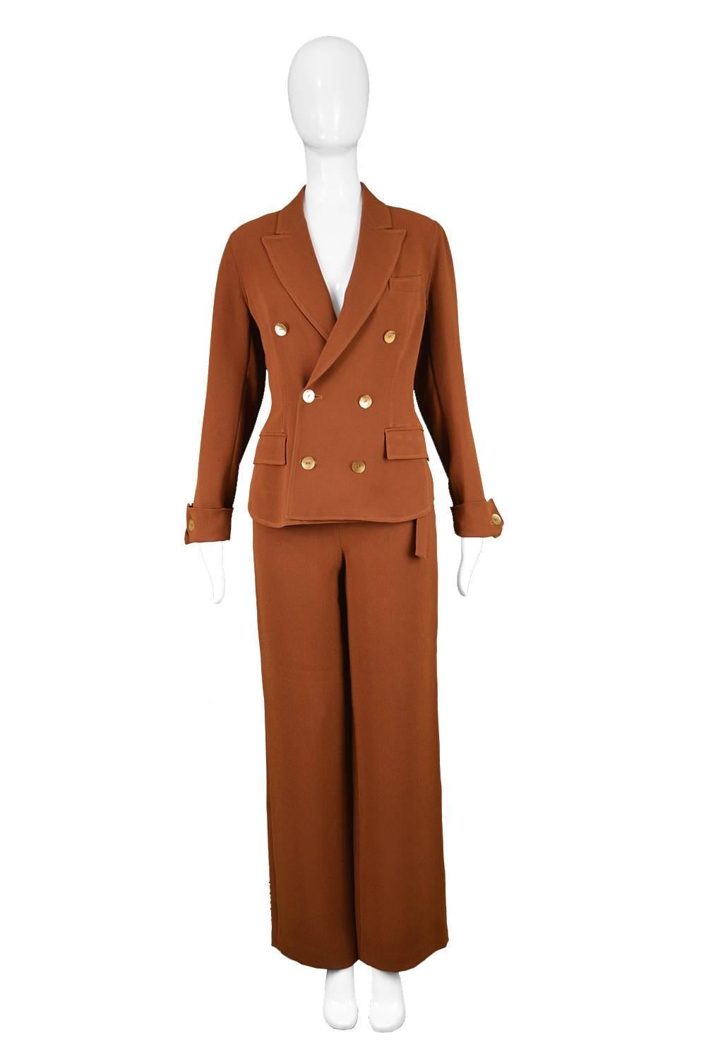 Jean Paul Gaultier Vintage 1990s Brown Crepe Wide Leg Palazzo Trouser Suit

Estimated Size: UK 10/ US 6/ EU 38. Please check measurements.
Jacket
Bust - 34” / 86cm
Waist - 30” / 76cm
Length (Shoulder to Hem) - 22” / 56cm
Shoulder to Shoulder - 16” /