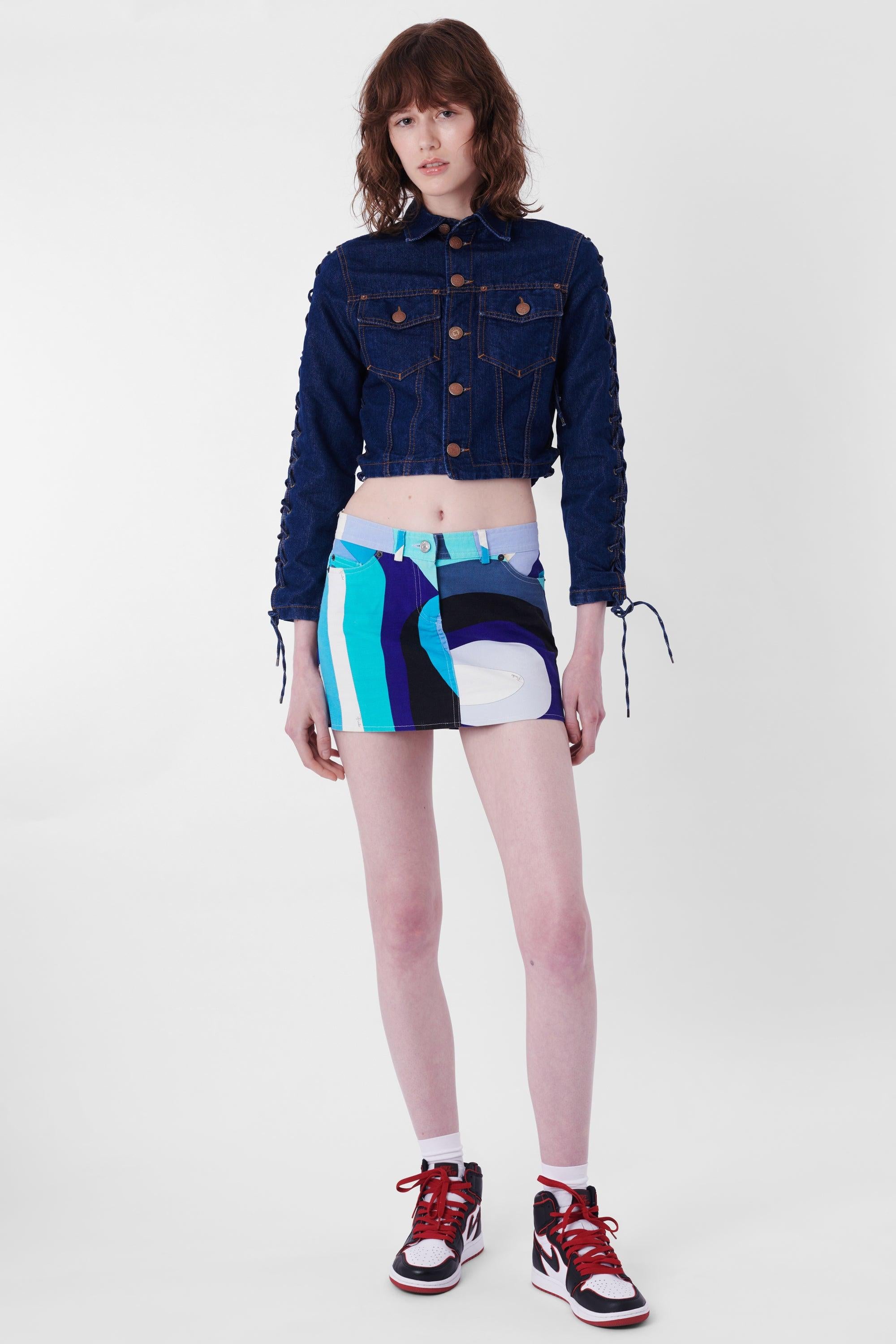 Nordic Poetry is excited to present this Jean Paul Gaultier 1990's Denim Lace Jacket. Features cropped cut, lace up sleeves and waist, two front pockets, collar and buttons for closure. In great vintage. condition. Authenticity guaranteed.

Label