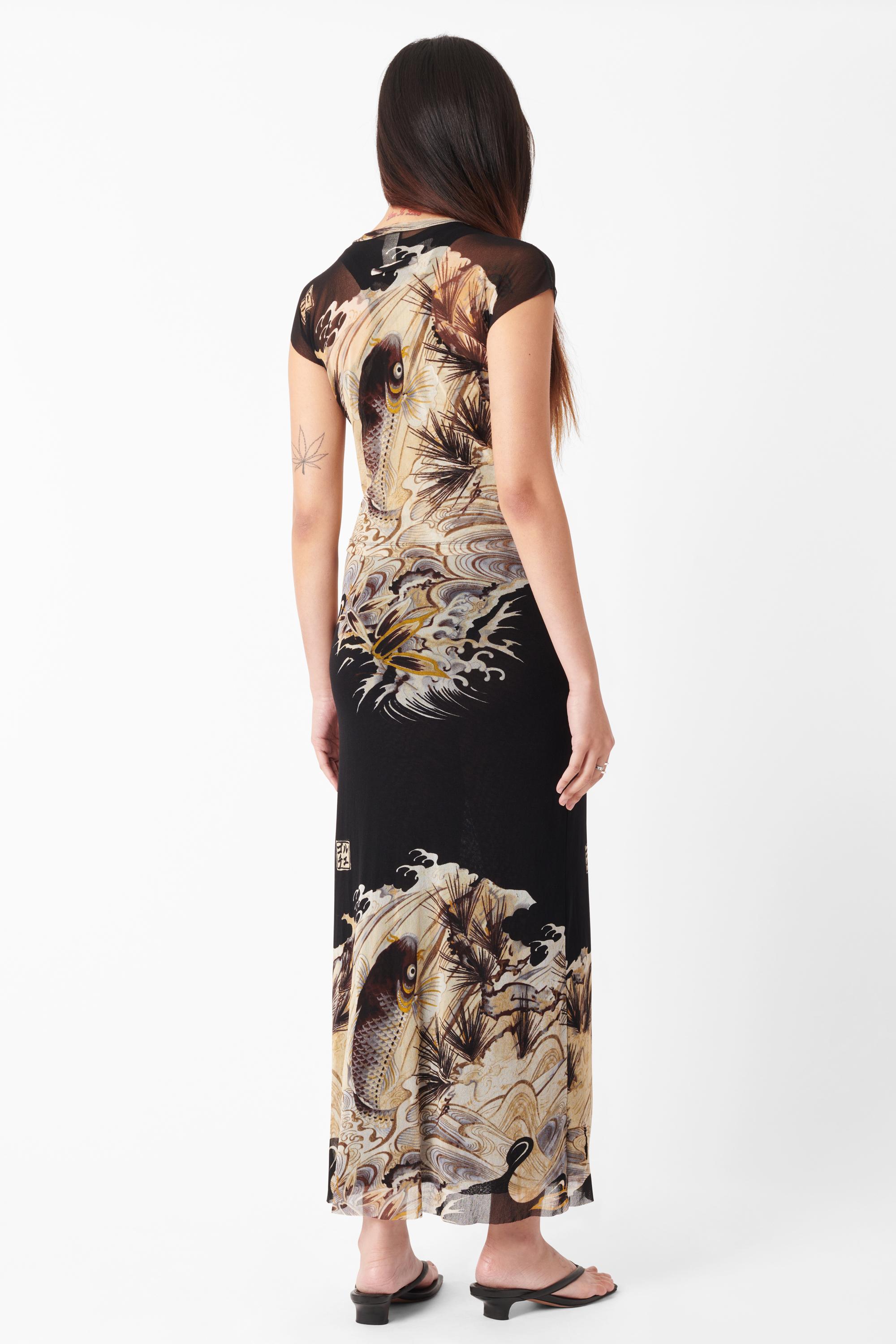 Vintage Jean Paul Gaultier circa 1990’s mesh dress and cardigan set with iconic Koi Fish print. Dress features classic Gaultier racerback tank dress in double layer mesh, Koi Fish print all over in a maxi length. Cardigan bolero features cap short