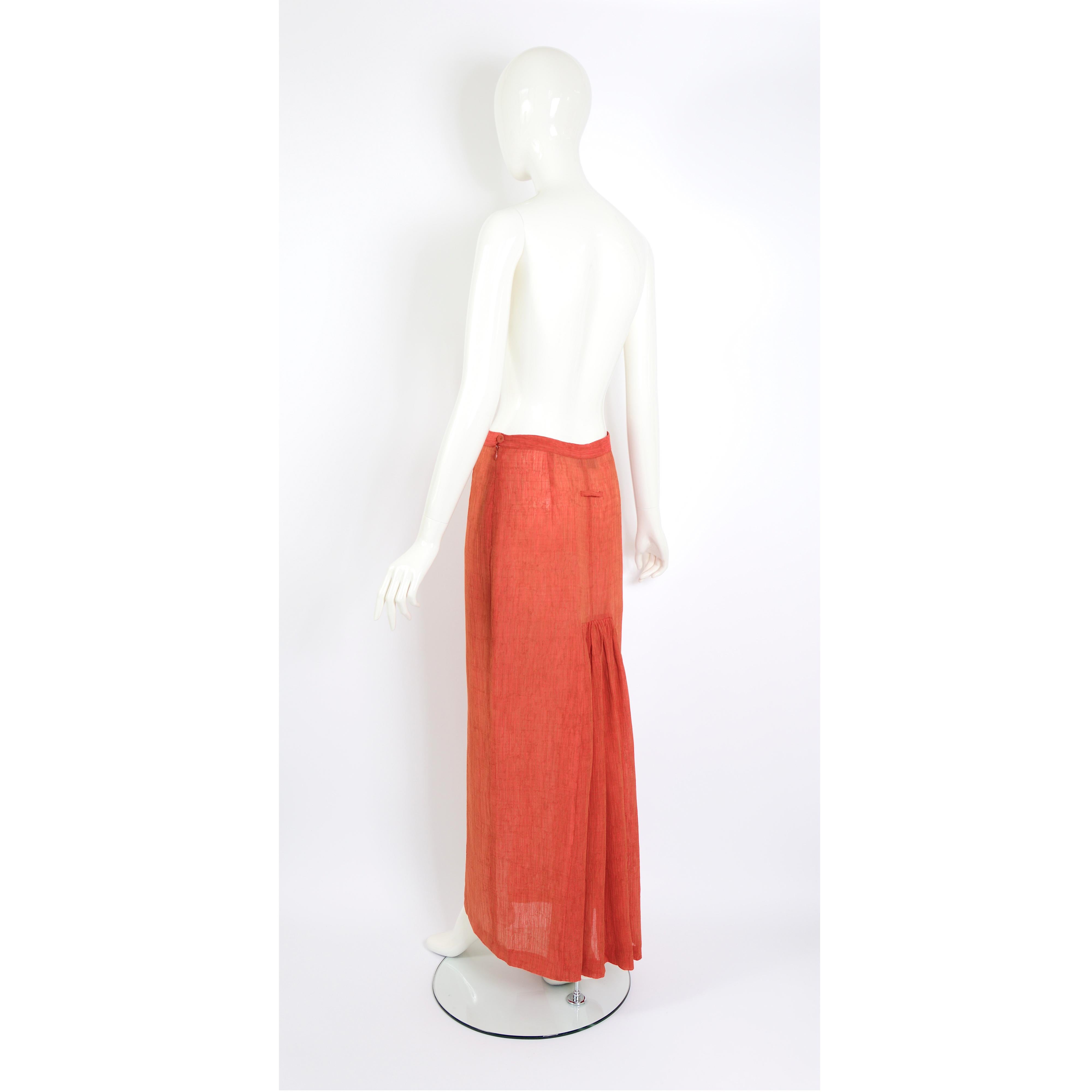 A beautiful Jean-Paul Gaultier vintage 1990s pleated back long terracotta orange color skirt. 
Size USA 10 - Italy 44 - Fr 40 - GB 12 
Measurements taken flat: Waist 14inch/36cm(x2) - Hip 19inch/48cm(x2) - Total Length 41inch/104cm
The skirt works