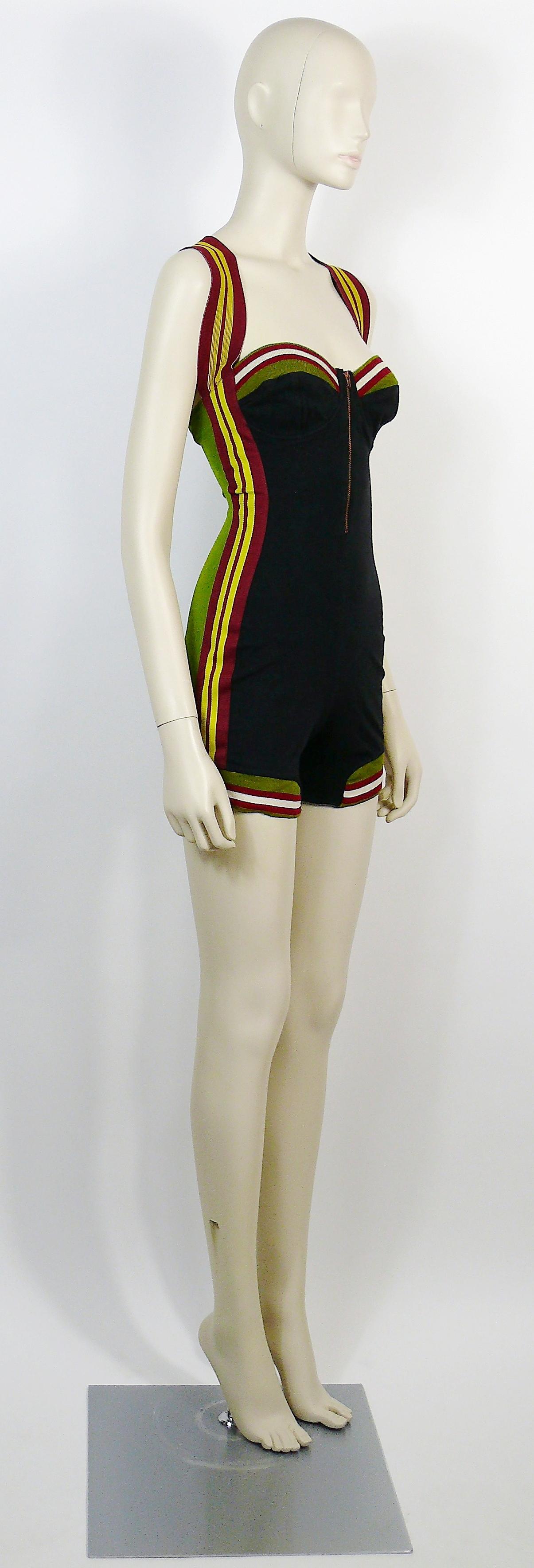 JEAN PAUL GAULTIER vintage rare 1990s black and green bustier shortall.

This shortall features :
- Black front and green back with multicolored knitted striped details.
- Boned bustier.
- Crisscross elasticated straps.
- Copper toned zipper at