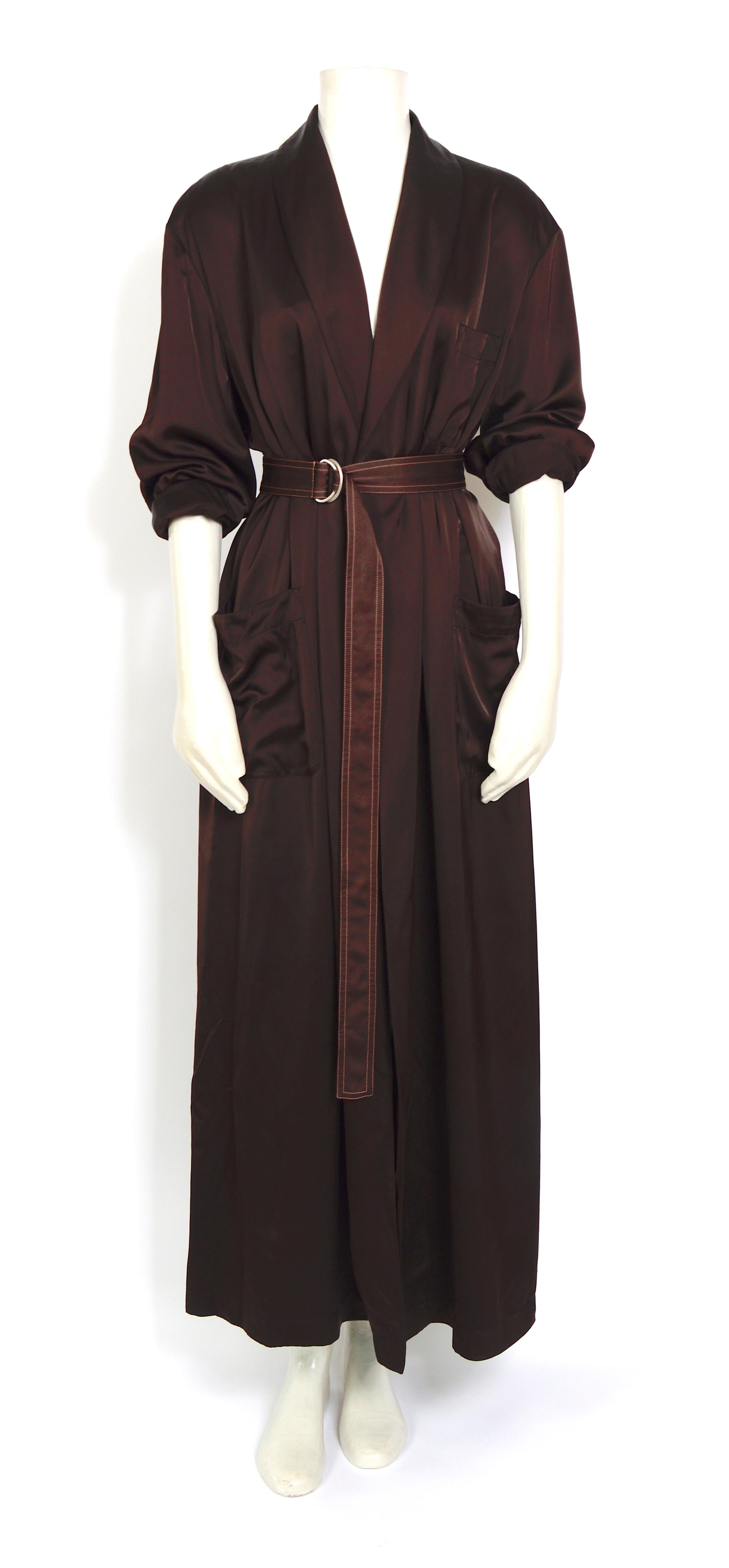 This is such a cool stunning vintage piece by Jean Paul Gaultier. Style robe morning coat or dress. 
Signature Gaultier on the back 
Size M 
In excellent vintage condition. No damage 
Made in Chocolate brown rayon material.
Measurements taken flat :