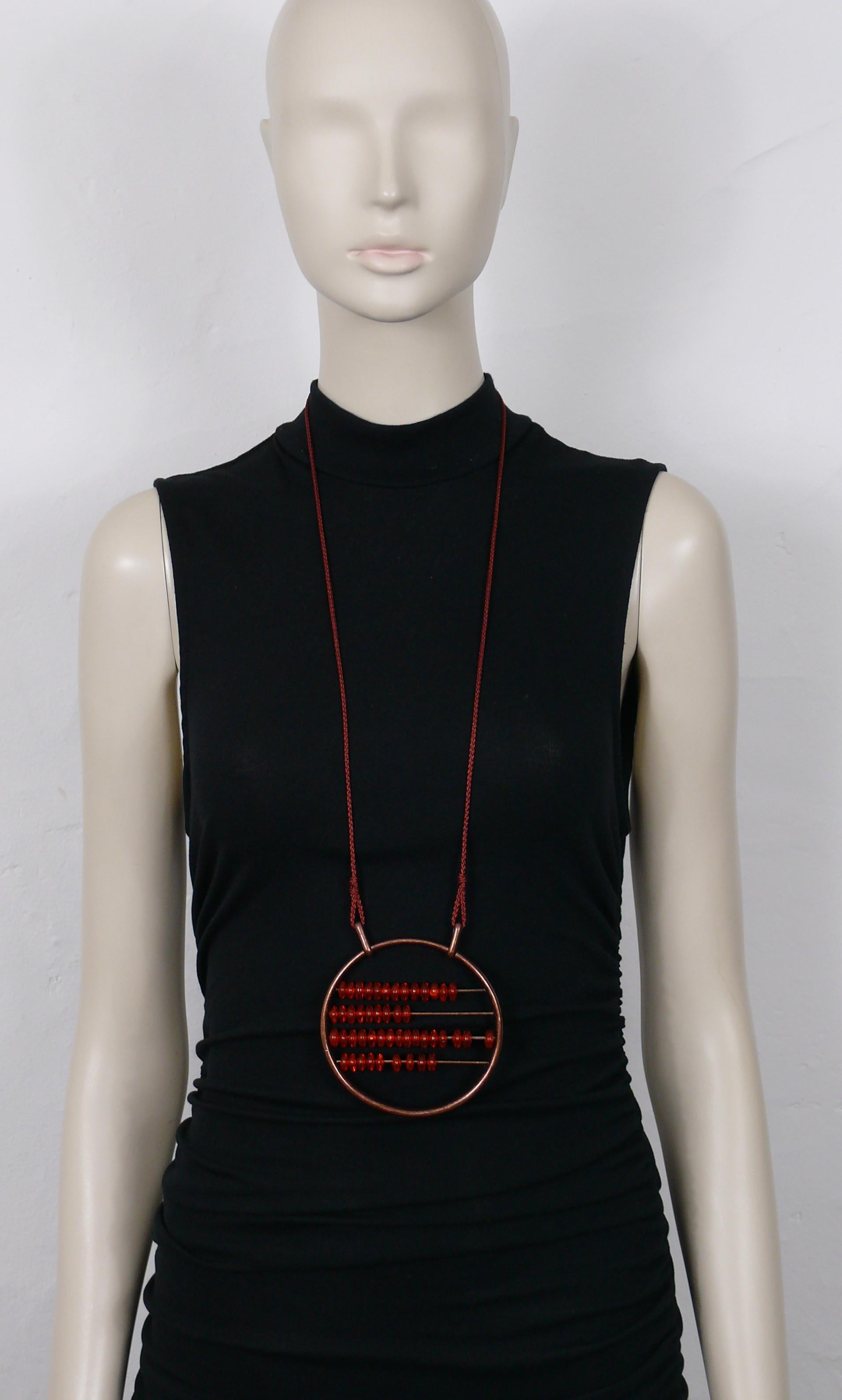 JEAN PAUL GAULTIER vintage cord and tassel necklace featuring a large antiqued copper toned abacus pendant with orange resin beads.

Embossed GAULTIER.

Indicative measurements : wearable length approx. 46 cm (18.11 inches) / abacus diameter approx.