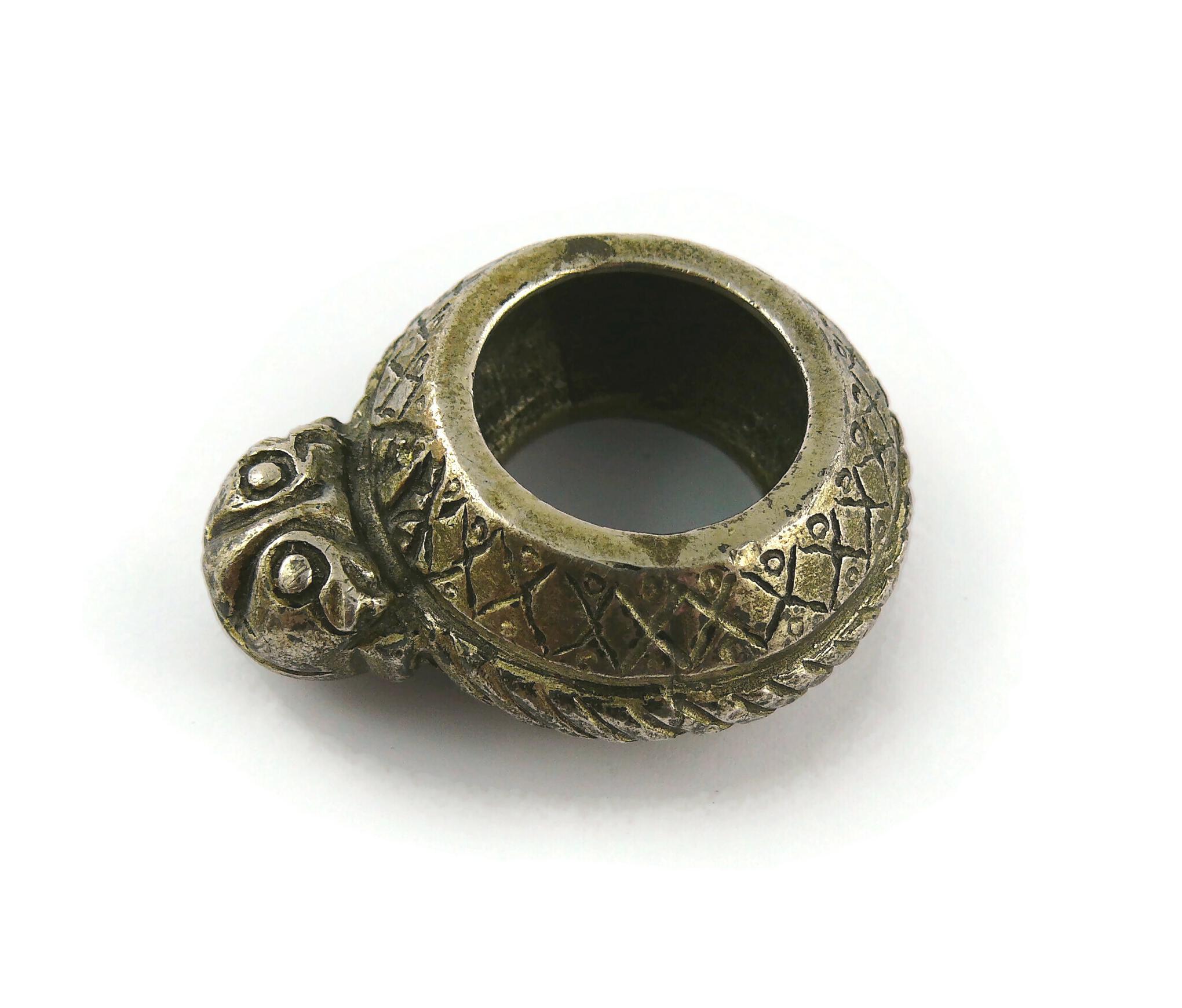 JEAN PAUL GAULTIER vintage antiqued silver toned massive ring featuring an African ethnic design.

Silver tone metal hardware.
Antiqued patina.

The oxidized/distressed patina and brutalist design is from original manufacturing.

Marked