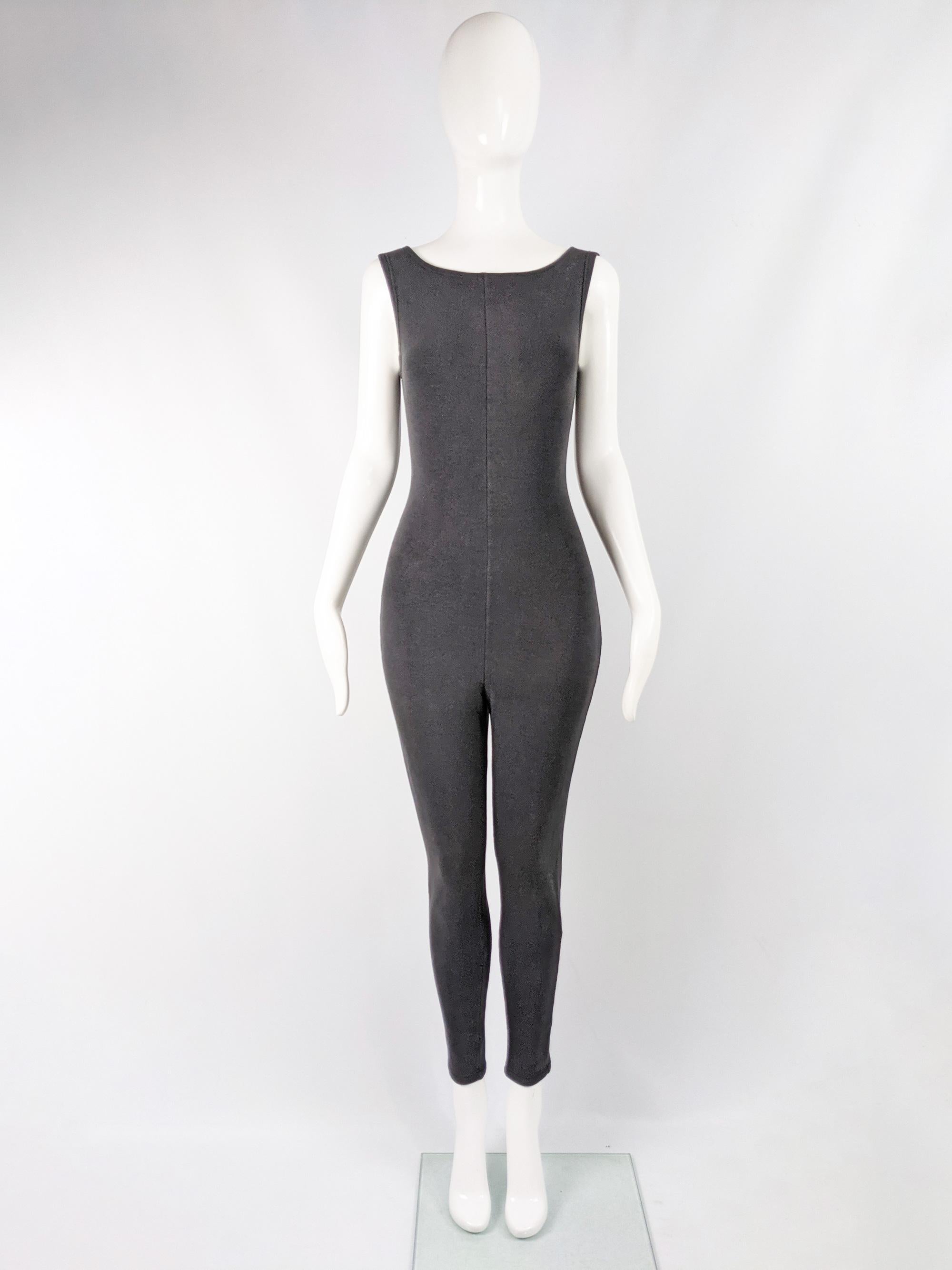 A fabulous and rare vintage Jean Paul Gaultier jumpsuit from the 80s. In a black or darkest grey body conscious jersey with a sleeveless, minimalist design and long legs.

Size: Marked IT 42 which equates to a UK 10/ US 6/ EU 38. Please check