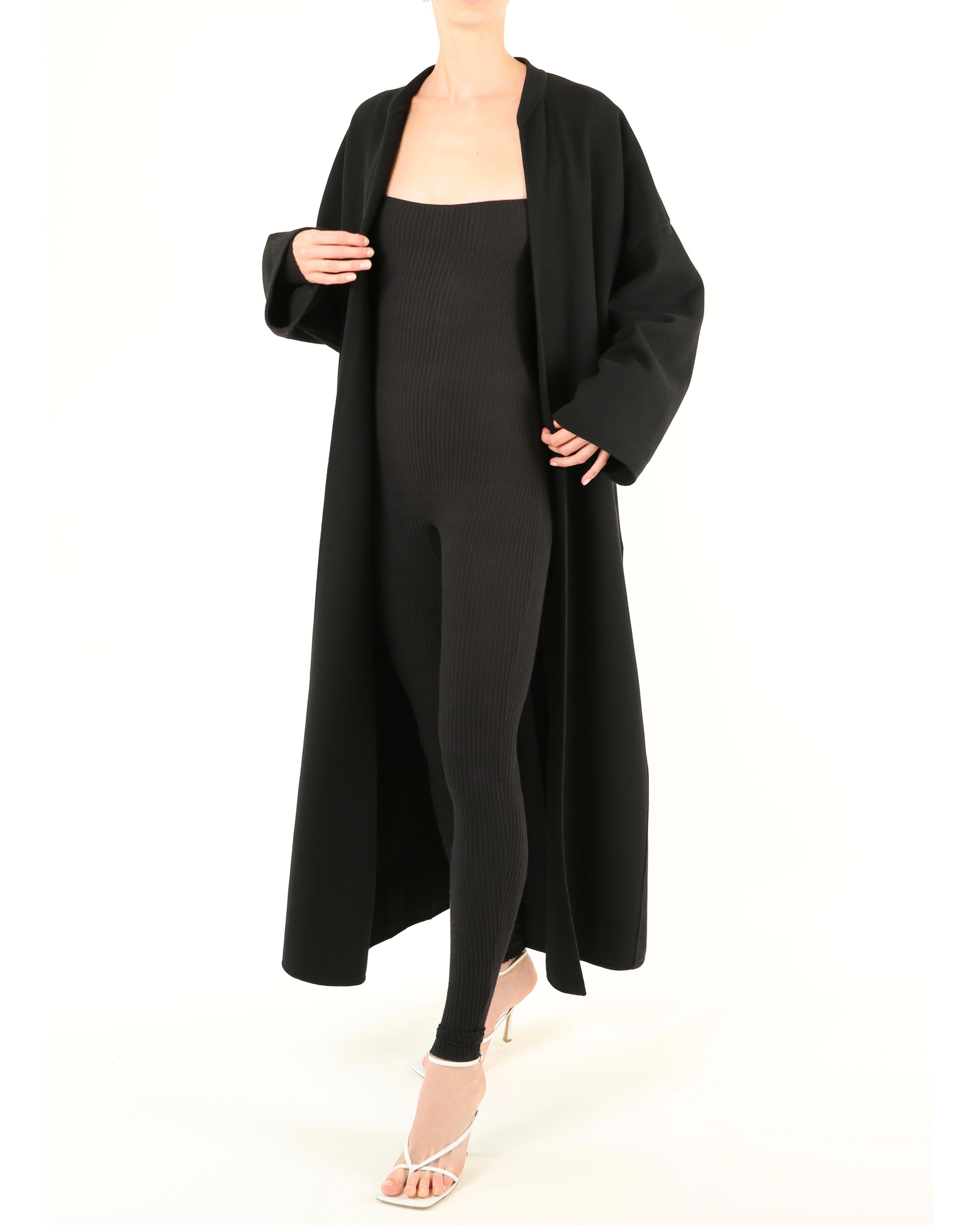 LOVE LALI Vintage

Jean Paul Gaultier vintage black wool cocoon style open over coat
Drop shoulders 
Pleated back detail
Whilst this shows as not quite full length on my model, she is very tall, so this would be full length on someone of lesser