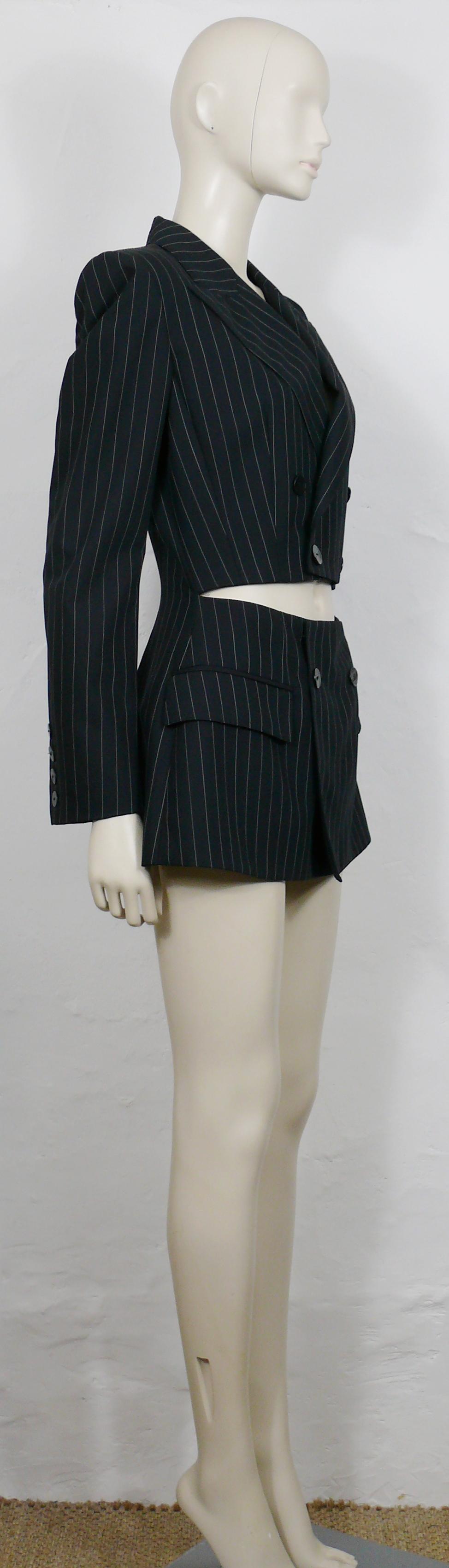 JEAN PAUL GAULTIER vintage black pinstripe cut-out waist double breasted blazer jacket.

This blazer features :
- Black virgin wool fabric with white pinstripes.
- Classic lapel collar.
- Cut-out waist.
- Double breasted.
- Two faux pockets.
-
