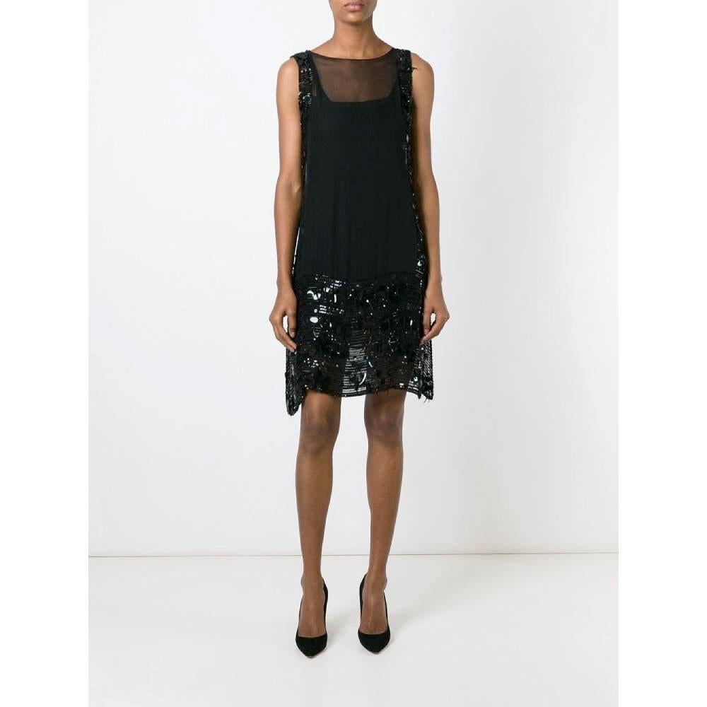 Jean Paul Gaultier black semitransparent silk sleeveless midi 2000s dress with slipdress. Round collar, embellished with side and bottom black different sequins.

Size: 38 FR

Flat measurements
Height: 98 cm
Bust: 43 cm

Product code:
