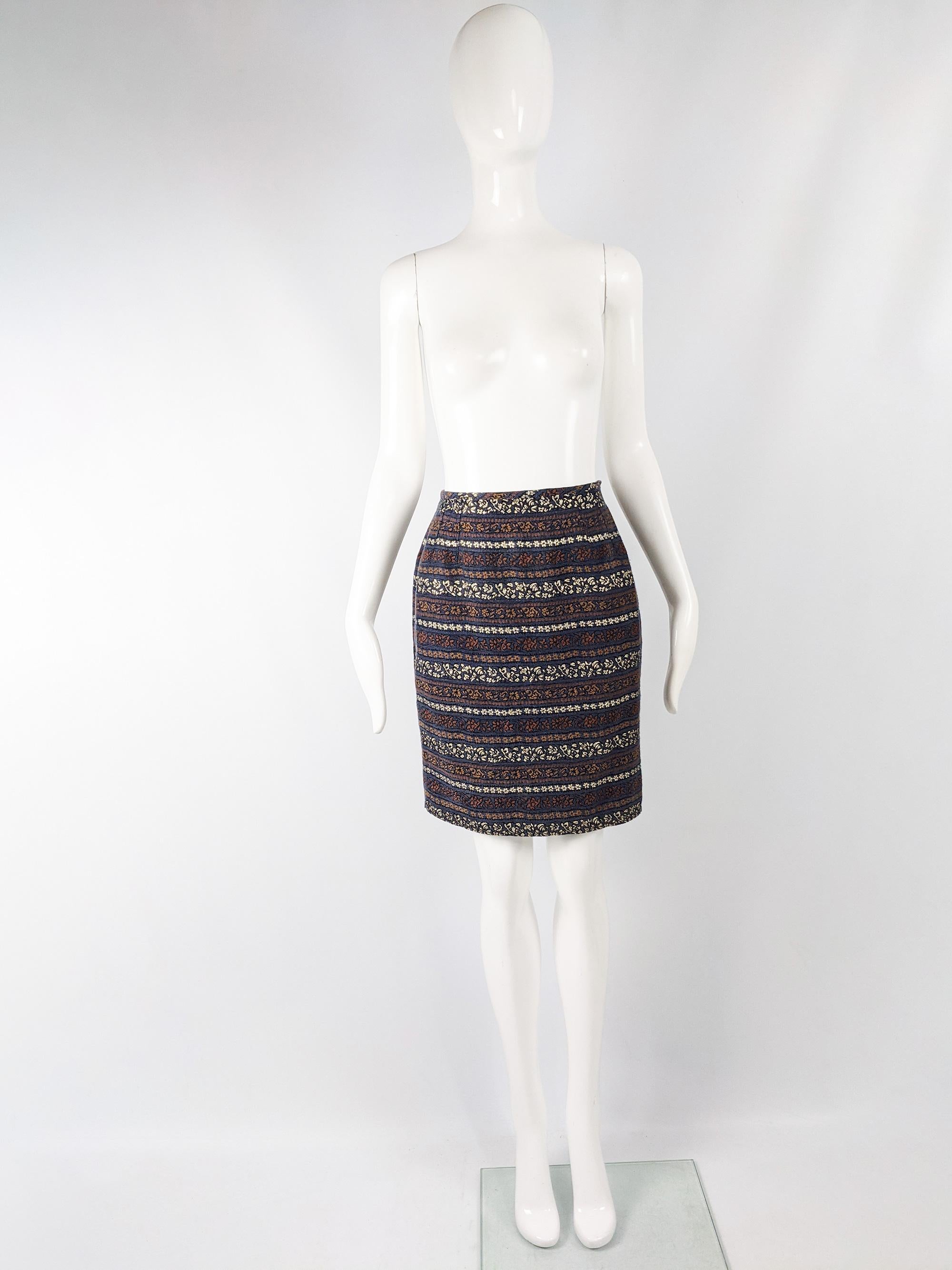 A fabulous vintage womens skirt from the 80s by iconic French fashion designer, Jean Paul Gaultier. Made in Italy, from a blue, gold and brown brocade with a floral pattern and flattering, pencil fit.

Size: Marked IT 42 which equates to a UK 10/ US